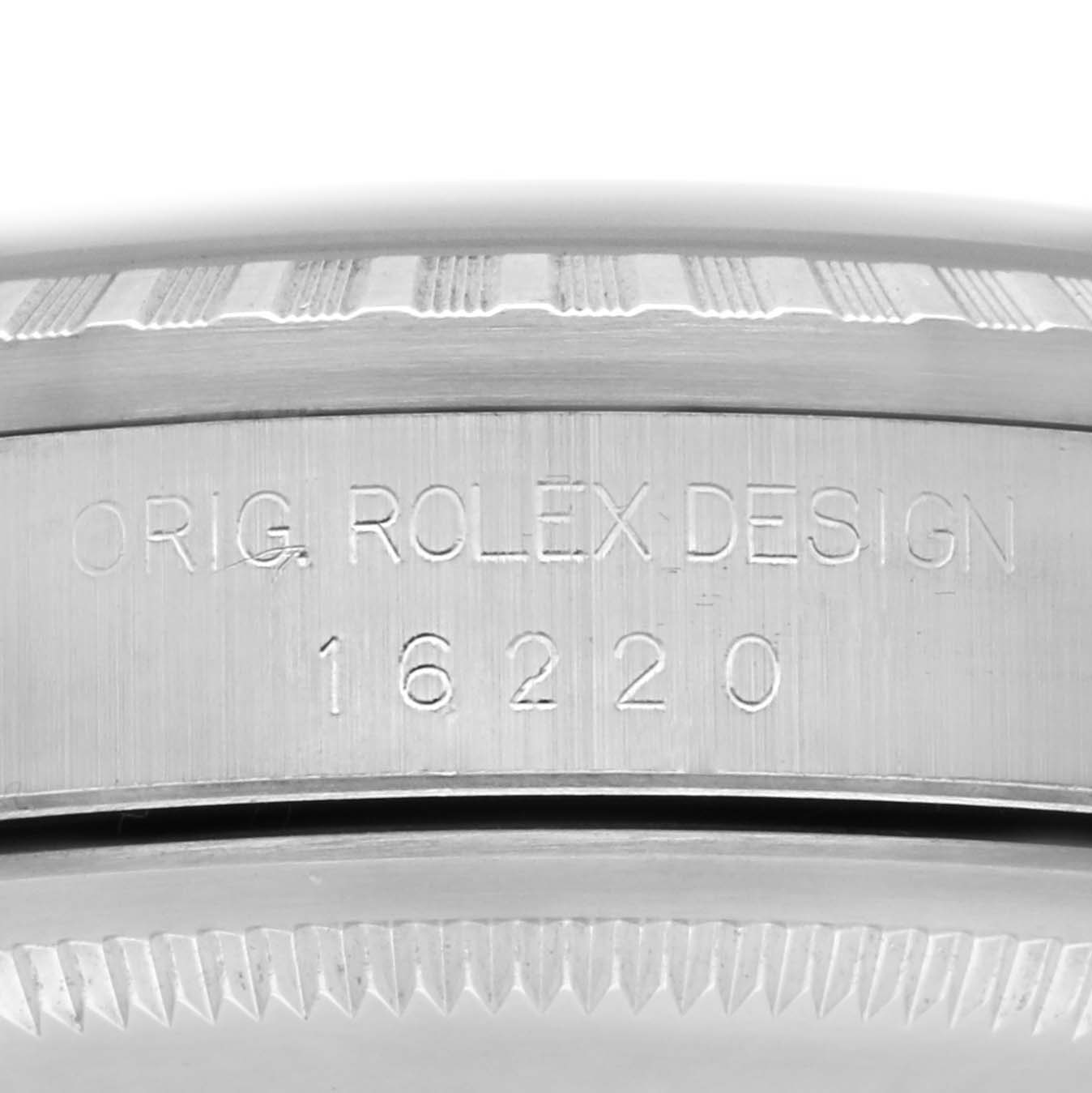 This image shows the side engraving of a Rolex Datejust 16220 Men's Stainless Steel Black Dial 16220 Men's Stainless Steel Black Dial watch case with its model number.