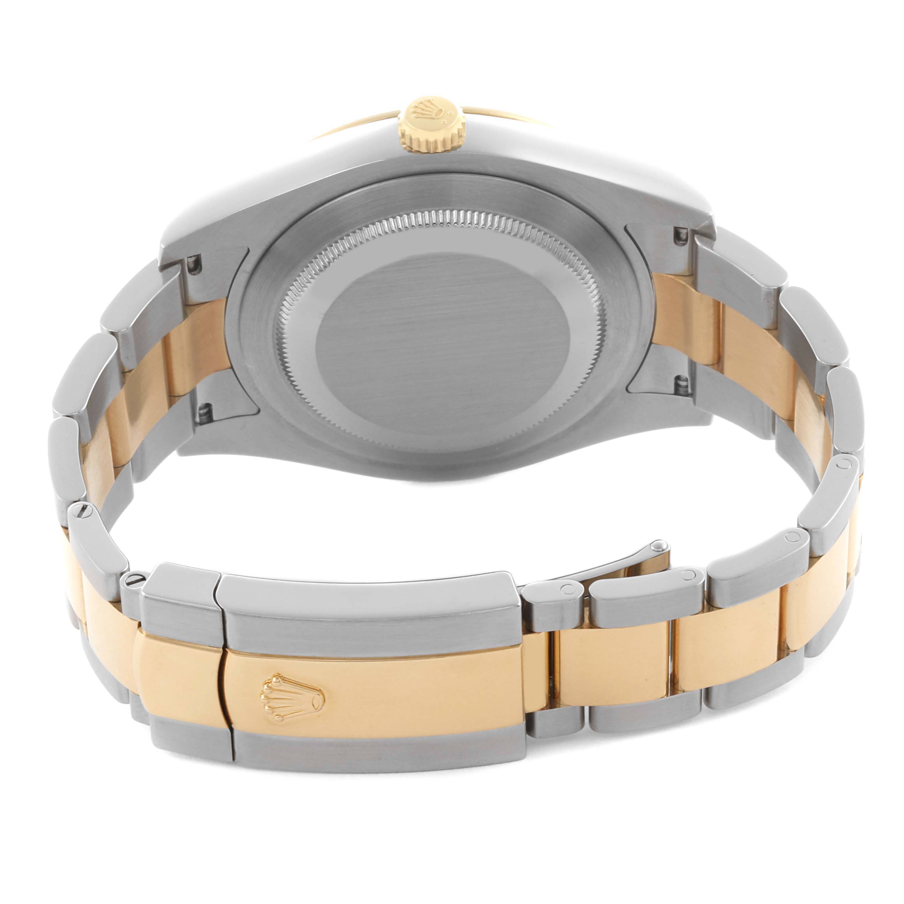 The Rolex Datejust 41 116333 Men's Steel and Gold (two tone) Champagne Dial 116333 Men's Steel and Gold (two tone) Champagne Dial is shown from the back, featuring the case back, crown, and two-tone bracelet with clasp.