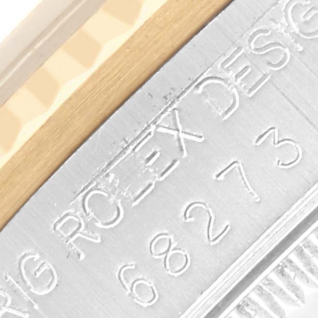 The image shows a close-up angle of the engraved side of the Rolex Mid-Size 68273 Women's Steel and Gold (two tone) White Dial 68273 Women's Steel and Gold (two tone) White Dial model case, highlighting the brand inscription.
