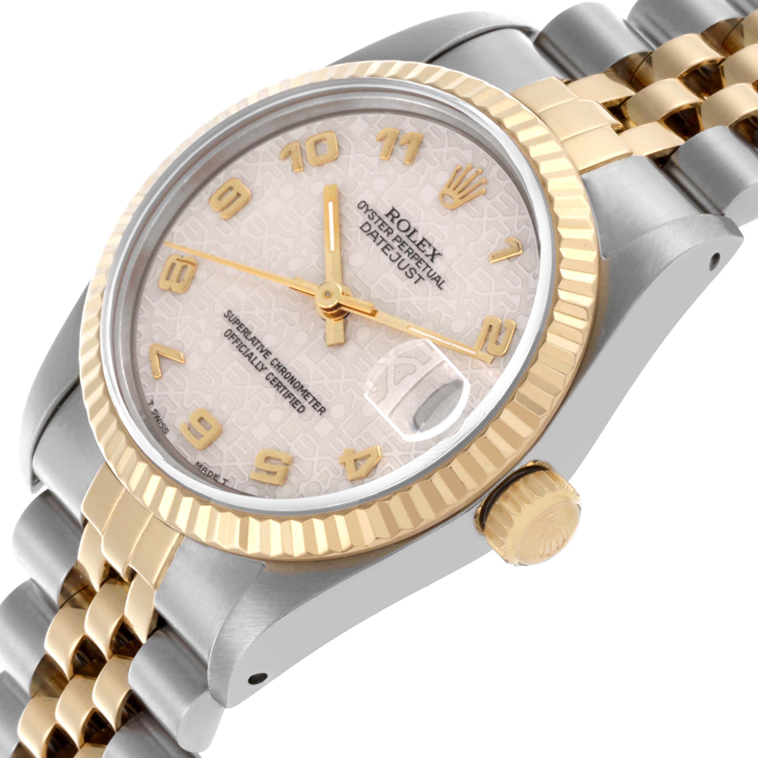 The Rolex Mid-Size 68273 Women's Steel and Gold (two tone) White Dial 68273 Women's Steel and Gold (two tone) White Dial Datejust is shown at an angle highlighting the gold bezel, dial, crown, and part of the bracelet.