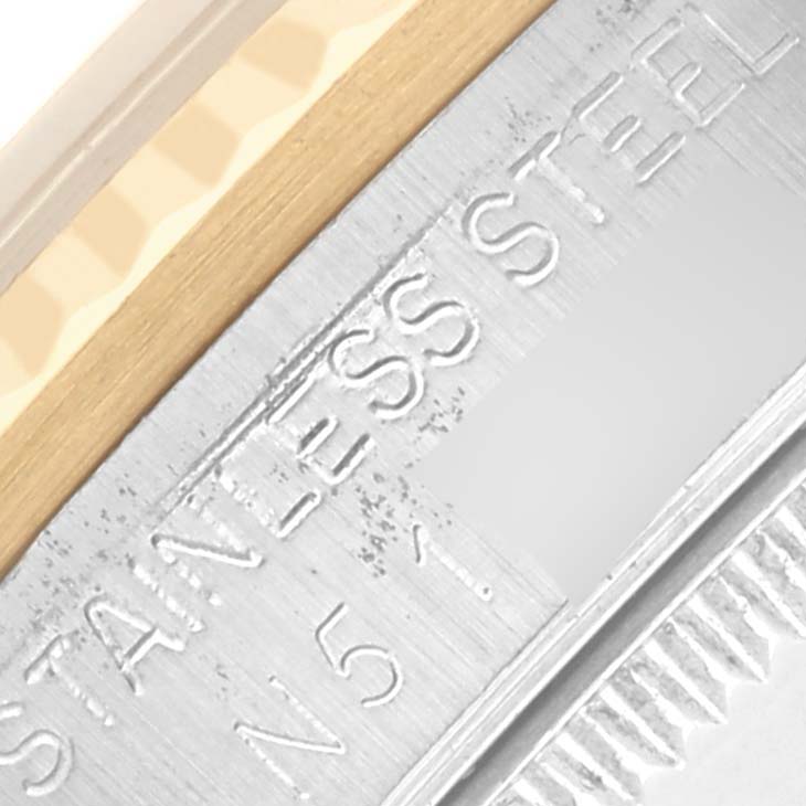 The image shows a close-up of the side of a Rolex Mid-Size 68273 Women's Steel and Gold (two tone) White Dial 68273 Women's Steel and Gold (two tone) White Dial watch, highlighting the stainless steel and engraving details.