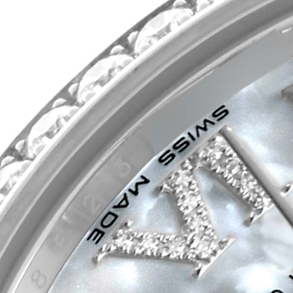 The image shows a close-up of the Rolex Datejust watch, highlighting the edge of the dial, part of the bezel, and "SWISS MADE" text.