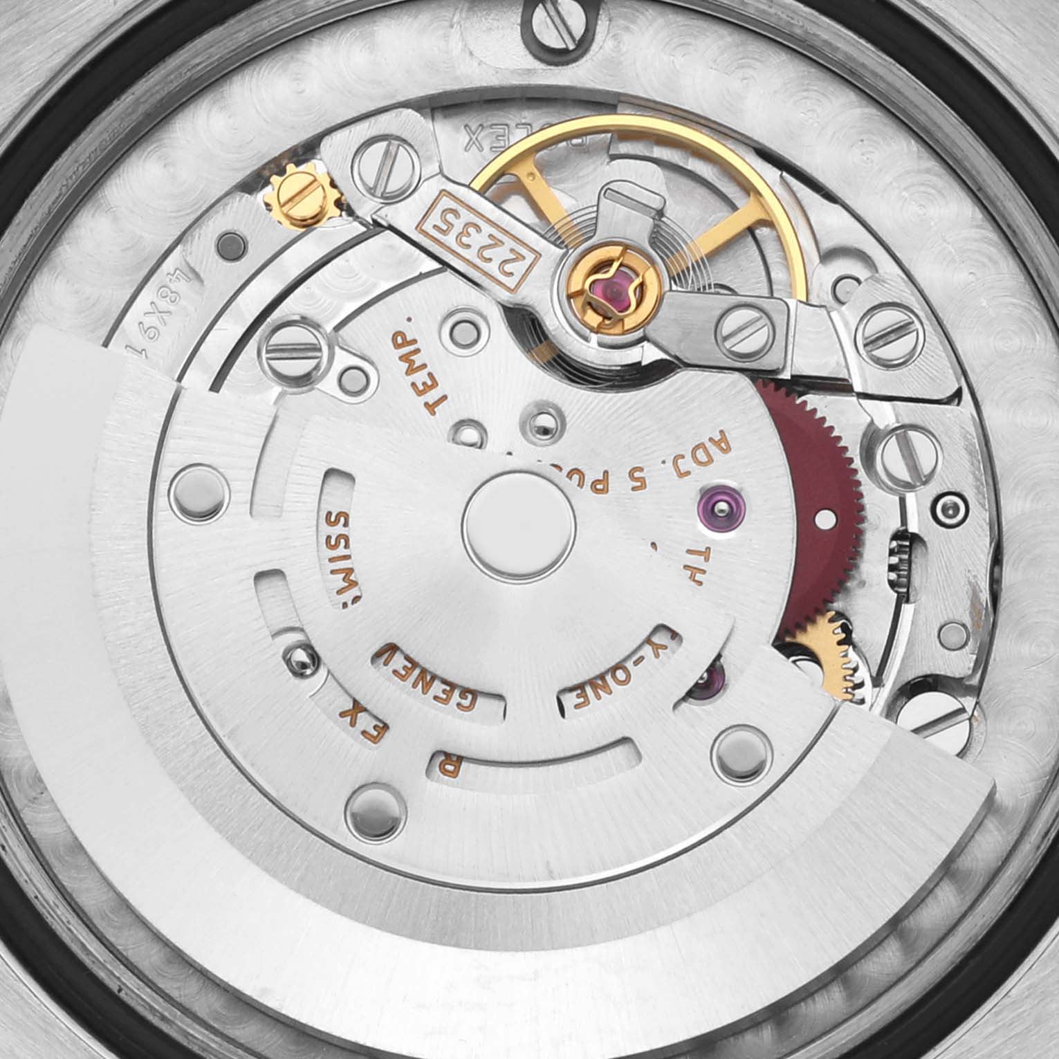 The image shows the movement of a Rolex Datejust watch, featuring gears, jewels, and the rotor at a close-up angle.
