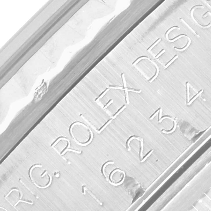 The image shows a close-up of the case side of a Rolex Datejust 16234 Men's Stainless Steel Mother of Pearl Dial 16234 Men's Stainless Steel Mother of Pearl Dial, highlighting the engraved model information.