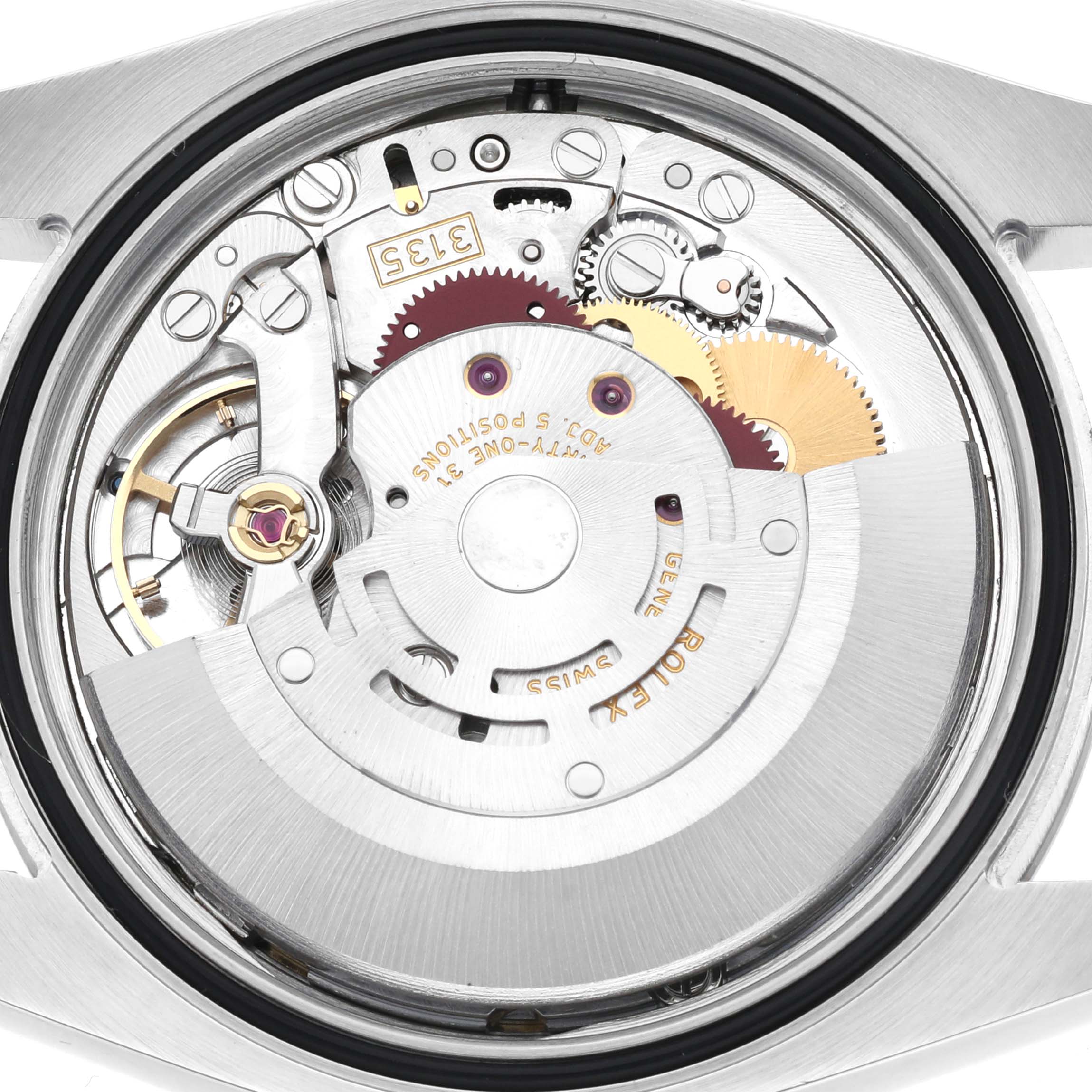 The image shows the movement of a Rolex Datejust 116234 Men's Stainless Steel Blue Dial 116234 Men's Stainless Steel Blue Dial watch from the back, highlighting its intricate gears and components.