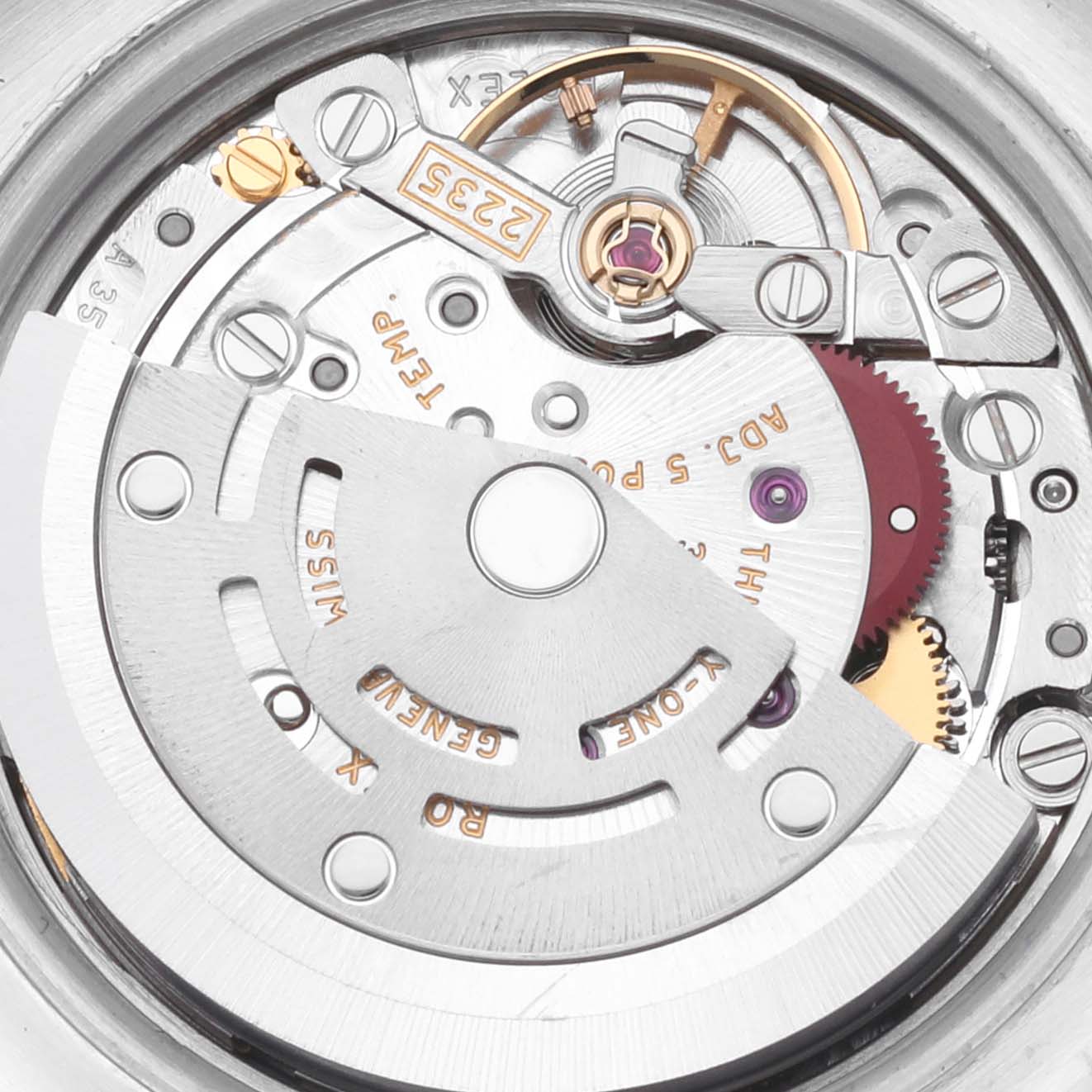 The image shows a close-up view of the Rolex Datejust 179174 Women's Stainless Steel Mother of Pearl Dial 179174 Women's Stainless Steel Mother of Pearl Dial's movement mechanism, highlighting the rotor, gears, and intricate parts.