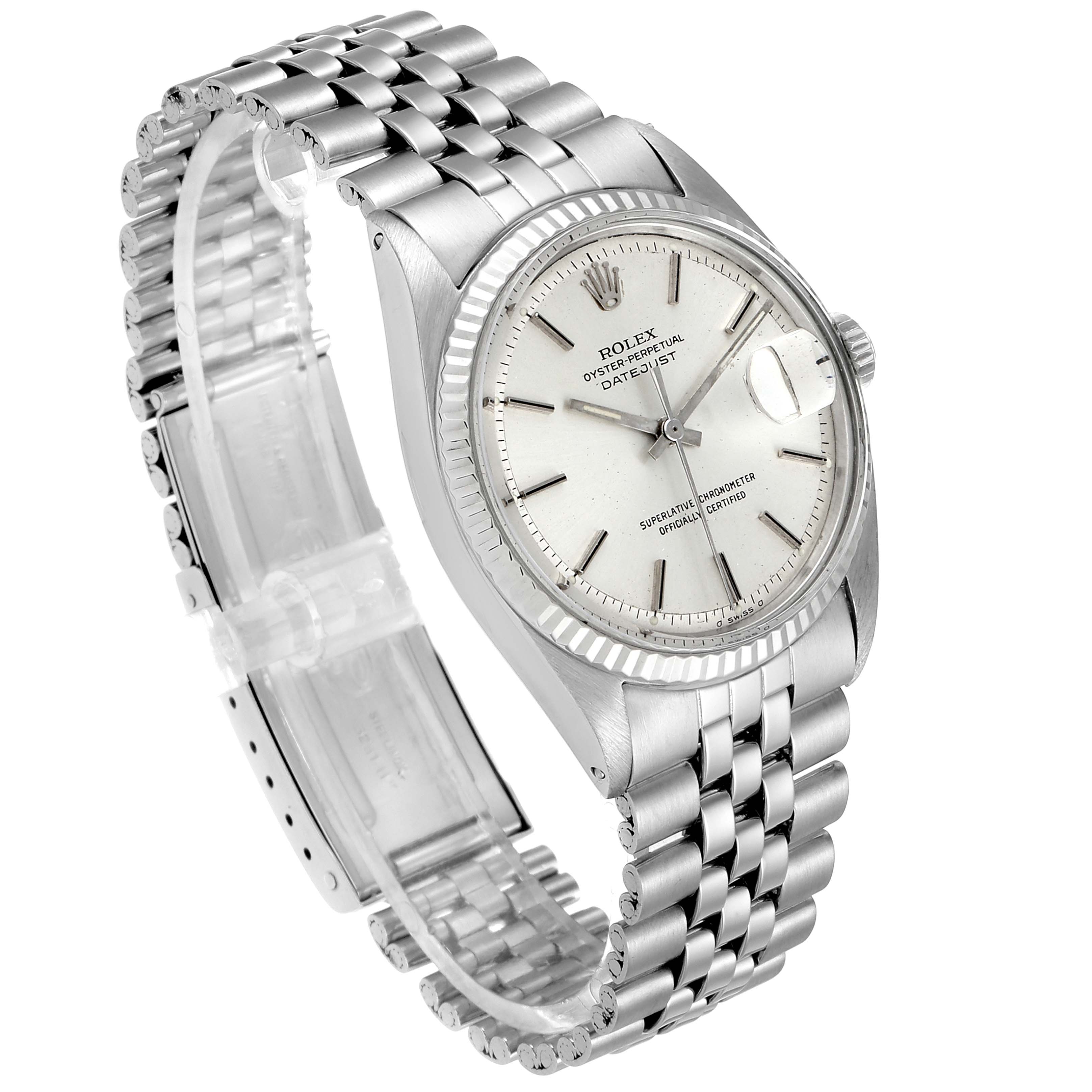 The image shows a Rolex Vintage Collection 1601 Men
s Stainless Steel Silver Dial 1601 Men
s Stainless Steel Silver Dial watch from an angled top view, showcasing its dial, bezel, and partially extended metal bracelet.