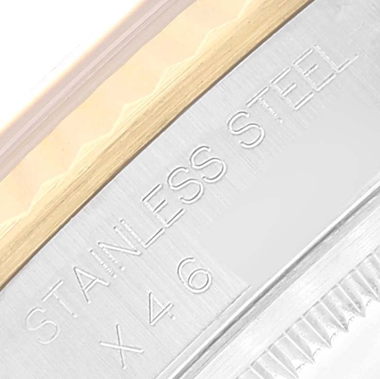 The image shows a close-up of the stainless steel case with "STAINLESS STEEL" engraved, part of the Rolex Datejust 16233 Men's Steel and Gold (two tone) Blue Dial 16233 Men's Steel and Gold (two tone) Blue Dial model.