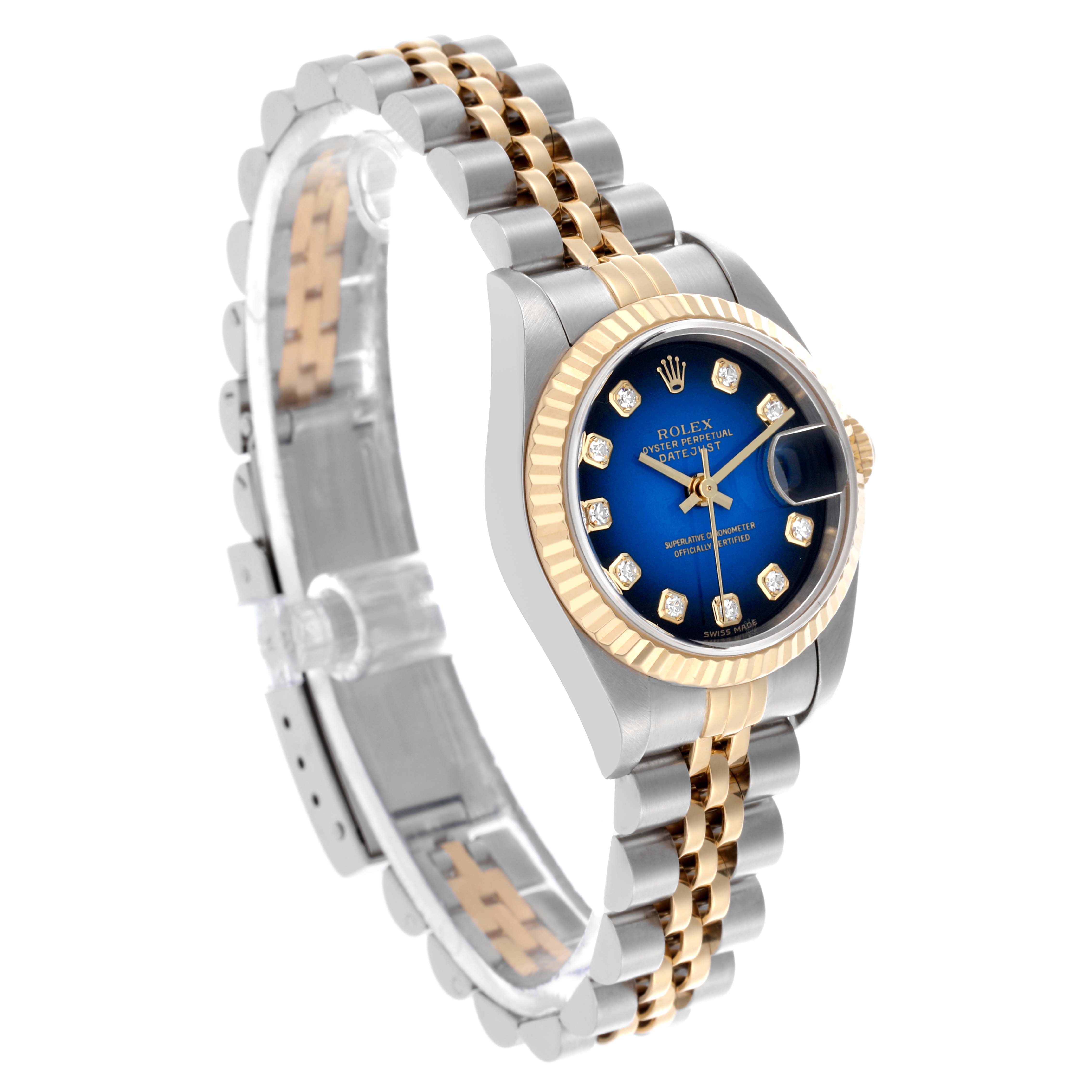 The Rolex Datejust 79173 Women's Steel and Gold (two tone) Blue Dial 79173 Women's Steel and Gold (two tone) Blue Dial watch is shown at an angled side view, highlighting the stainless steel and gold bracelet, blue dial, and fluted bezel.