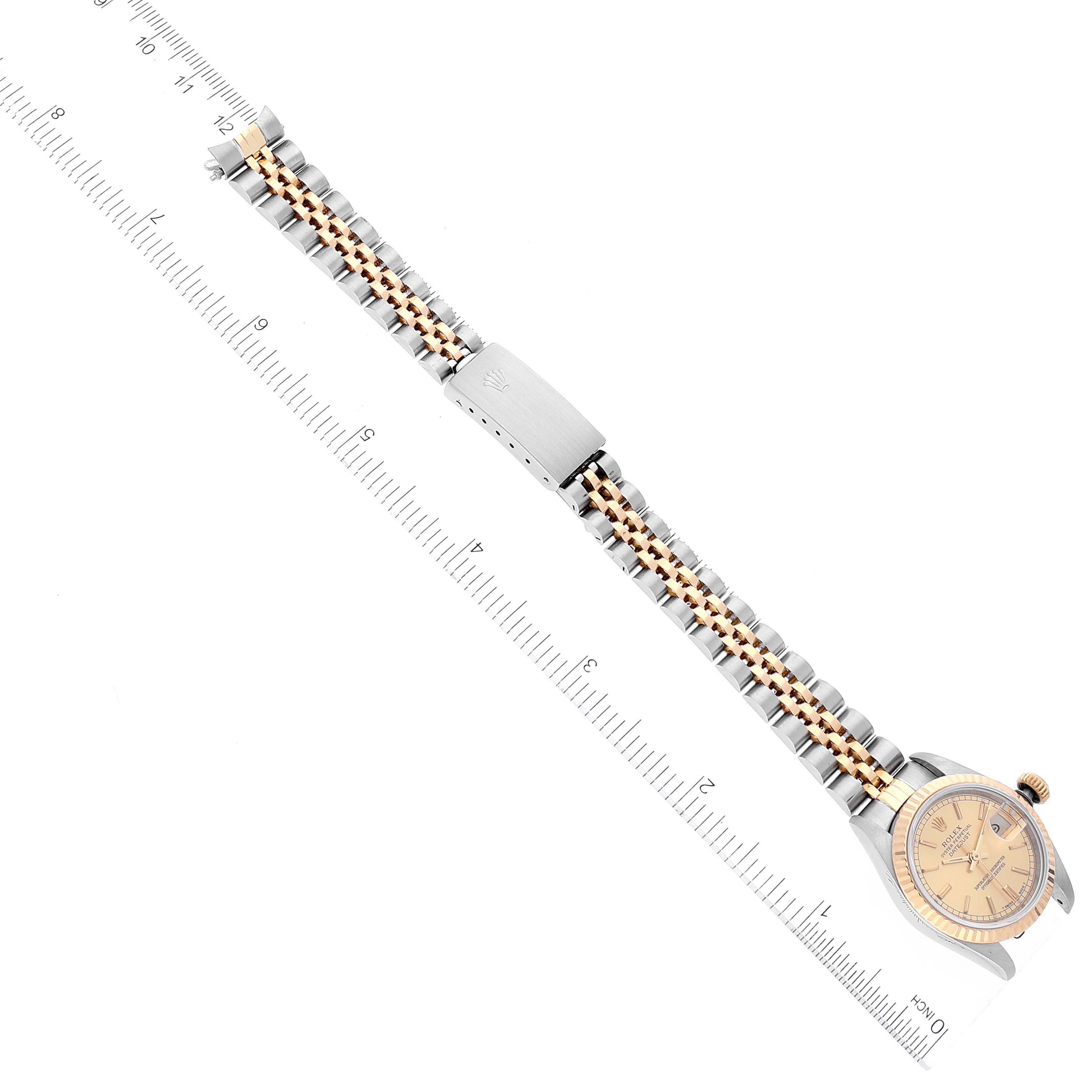 The image shows a Rolex Datejust 69173 Women's Steel and Gold (two tone) Champagne Dial 69173 Women's Steel and Gold (two tone) Champagne Dial watch from a top view, displaying the entire watch including its dial, bezel, bracelet, and clasp.