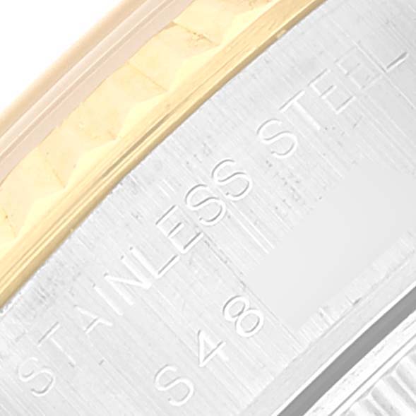 This image shows a close-up view of the Datejust Rolex watch bezel and the engraved stainless steel casing.