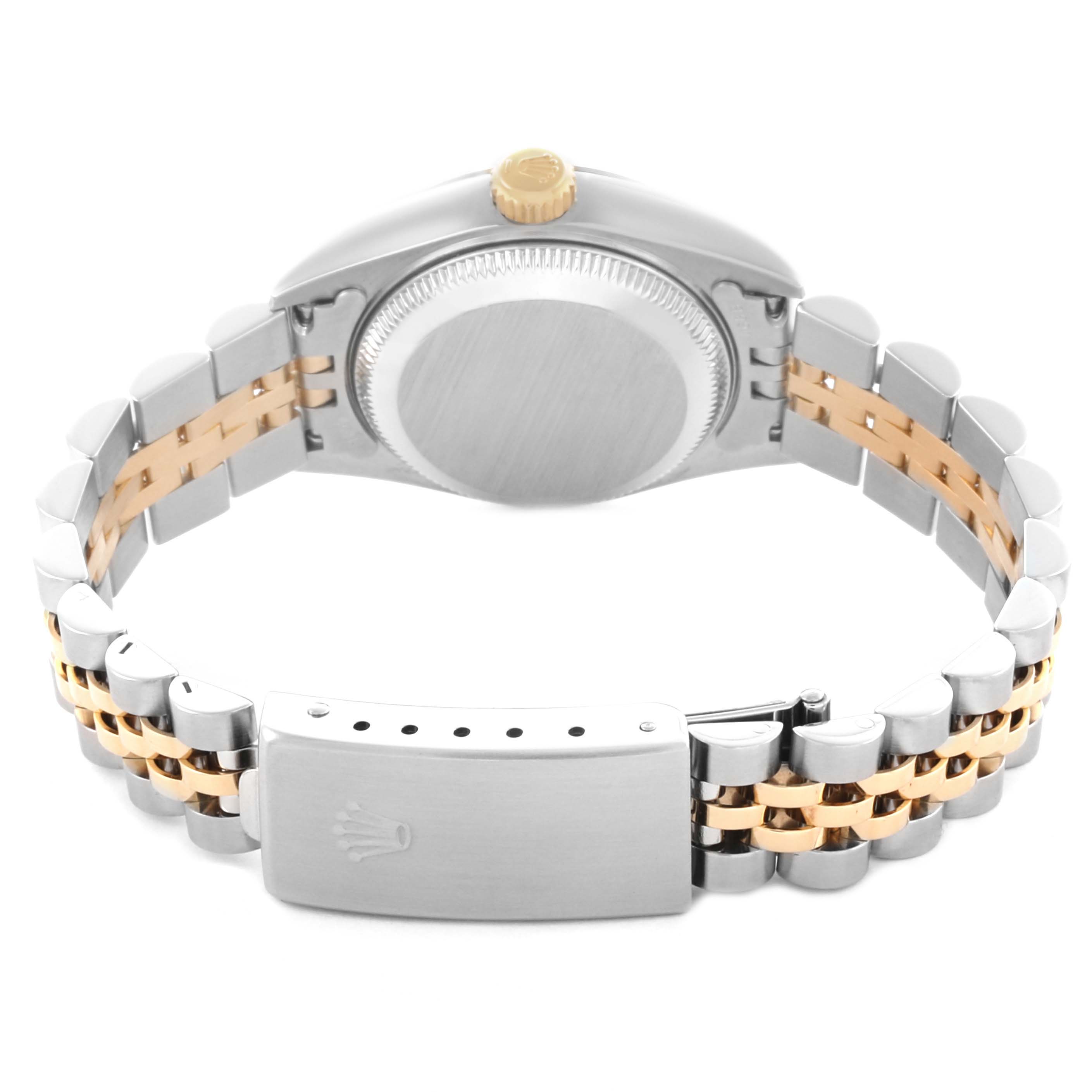 The Rolex Datejust 79173 Women's Steel and Gold (two tone) Champagne Dial 79173 Women's Steel and Gold (two tone) Champagne Dial watch is shown from the back, highlighting the case, bracelet, and clasp with a two-tone design.