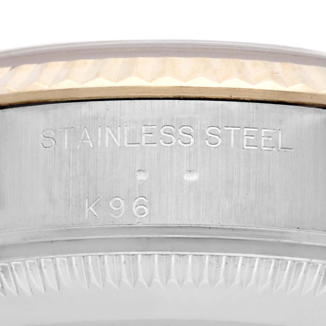 The image shows a close-up of the side of a Rolex Datejust 79173 Women's Steel and Gold (two tone) Champagne Dial 79173 Women's Steel and Gold (two tone) Champagne Dial, focusing on the stainless steel casing and part of the bezel.