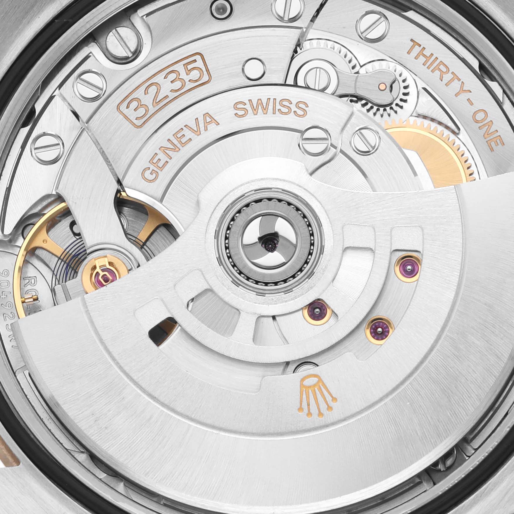 The image shows a close-up of the Rolex Datejust 126233 Men's Steel and Gold (two tone) Champagne Dial 126233 Men's Steel and Gold (two tone) Champagne Dial watch movement, highlighting the rotor and intricate internal components.