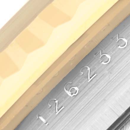 The image shows a close-up of the bezel and engraved serial number of a Rolex Datejust 126233 Men's Steel and Gold (two tone) Champagne Dial 126233 Men's Steel and Gold (two tone) Champagne Dial watch.