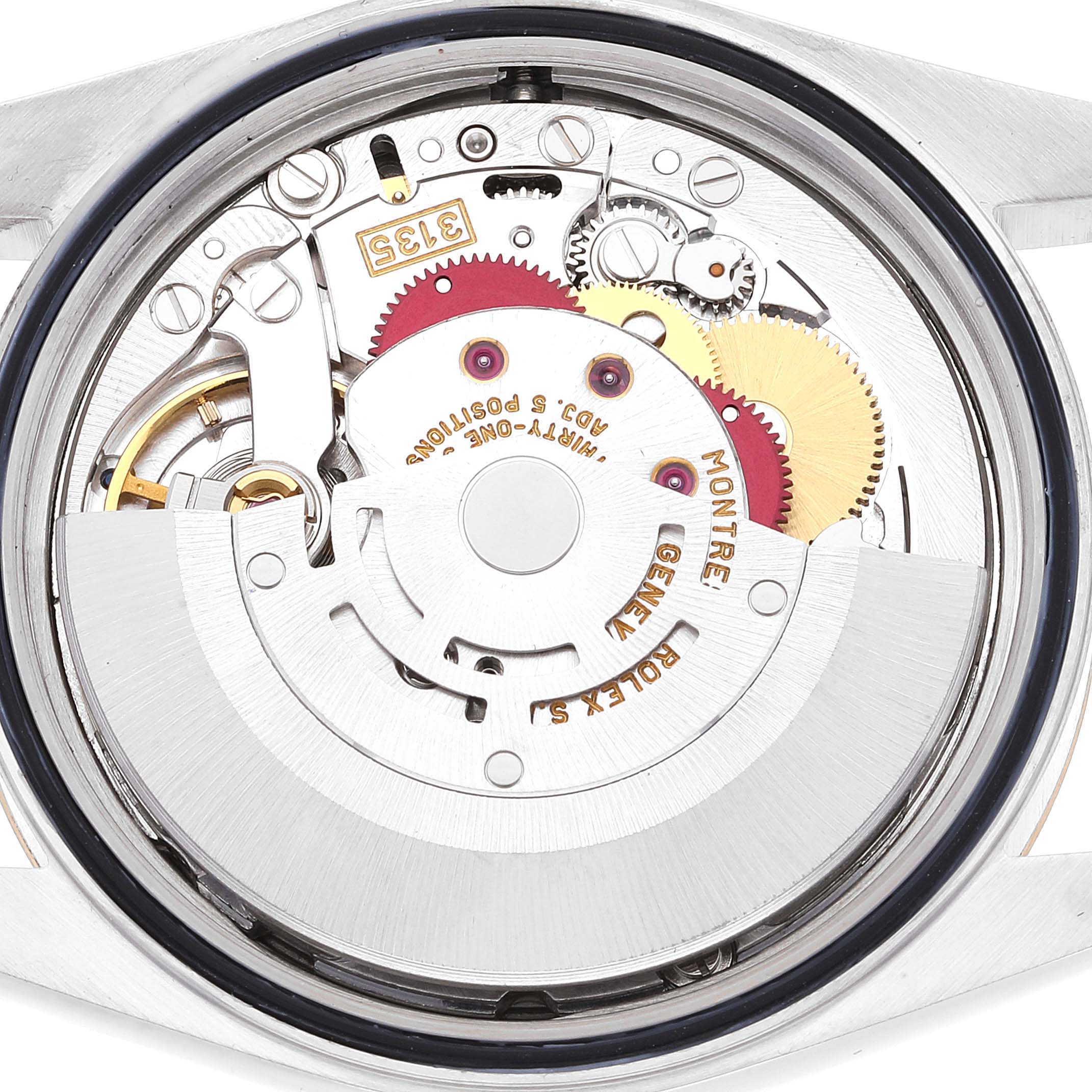 Close-up of the Rolex Datejust 16233 Men's Steel and Gold (two tone) Silver Dial 16233 Men's Steel and Gold (two tone) Silver Dial watch movement showing intricate internal gears and mechanisms.