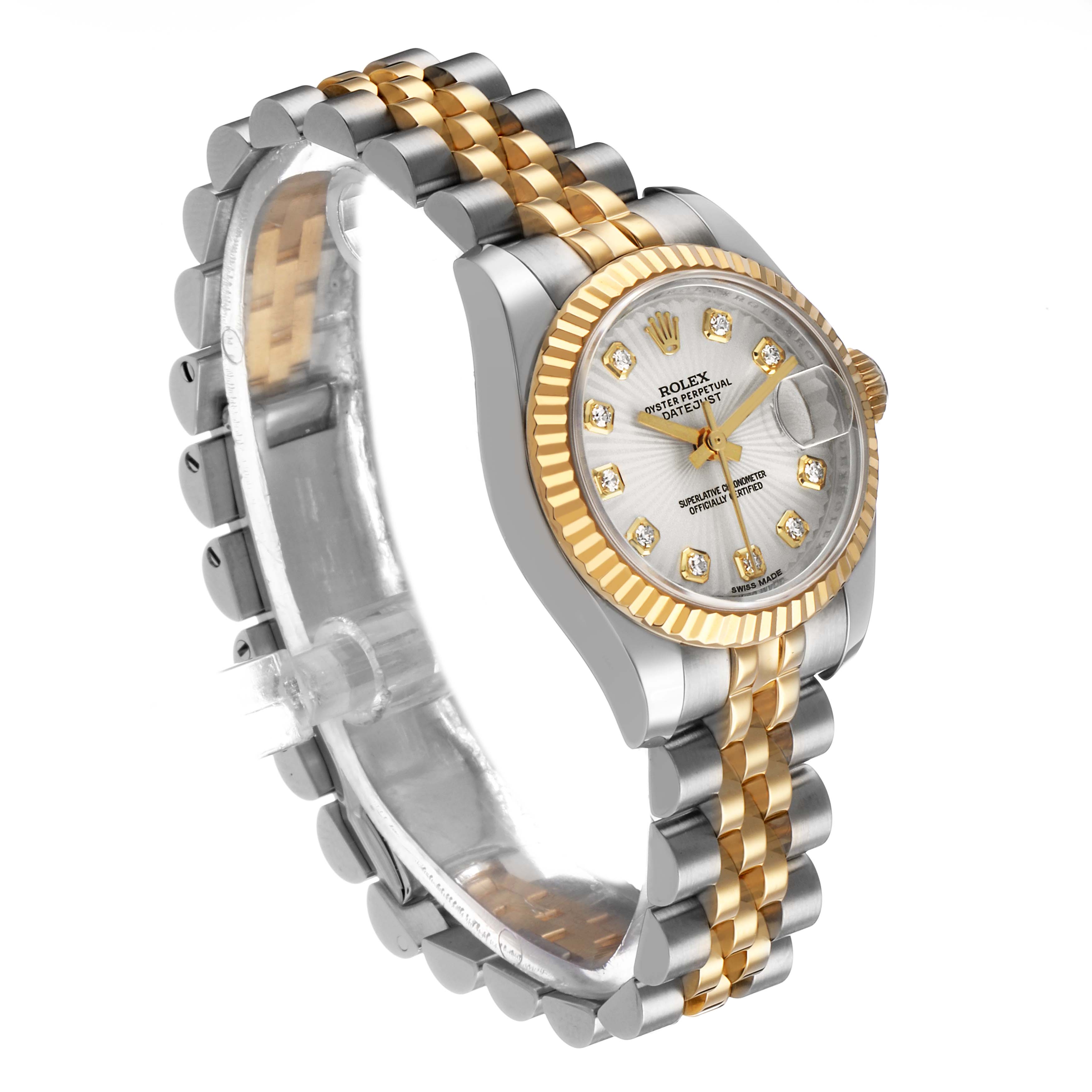 The Rolex Datejust 179173 Women's Stainless Steel Silver Dial watch is shown at an angled view, highlighting the face, fluted bezel, and two-tone bracelet.