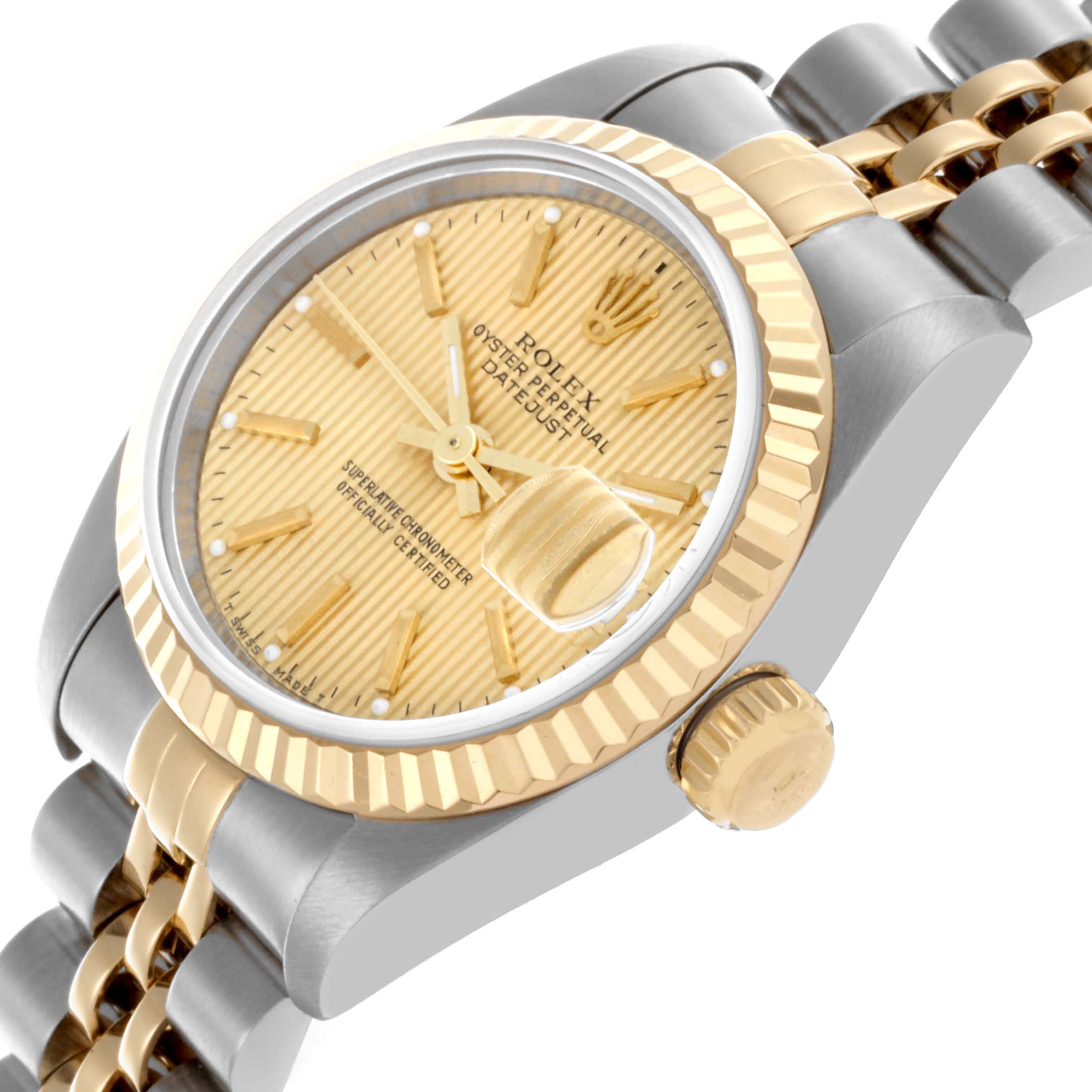 The Rolex Datejust 69173 Women's Steel and Gold (two tone) Champagne Dial 69173 Women's Steel and Gold (two tone) Champagne Dial watch is shown at an angle highlighting the dial, fluted bezel, and crown with part of the two-tone bracelet.