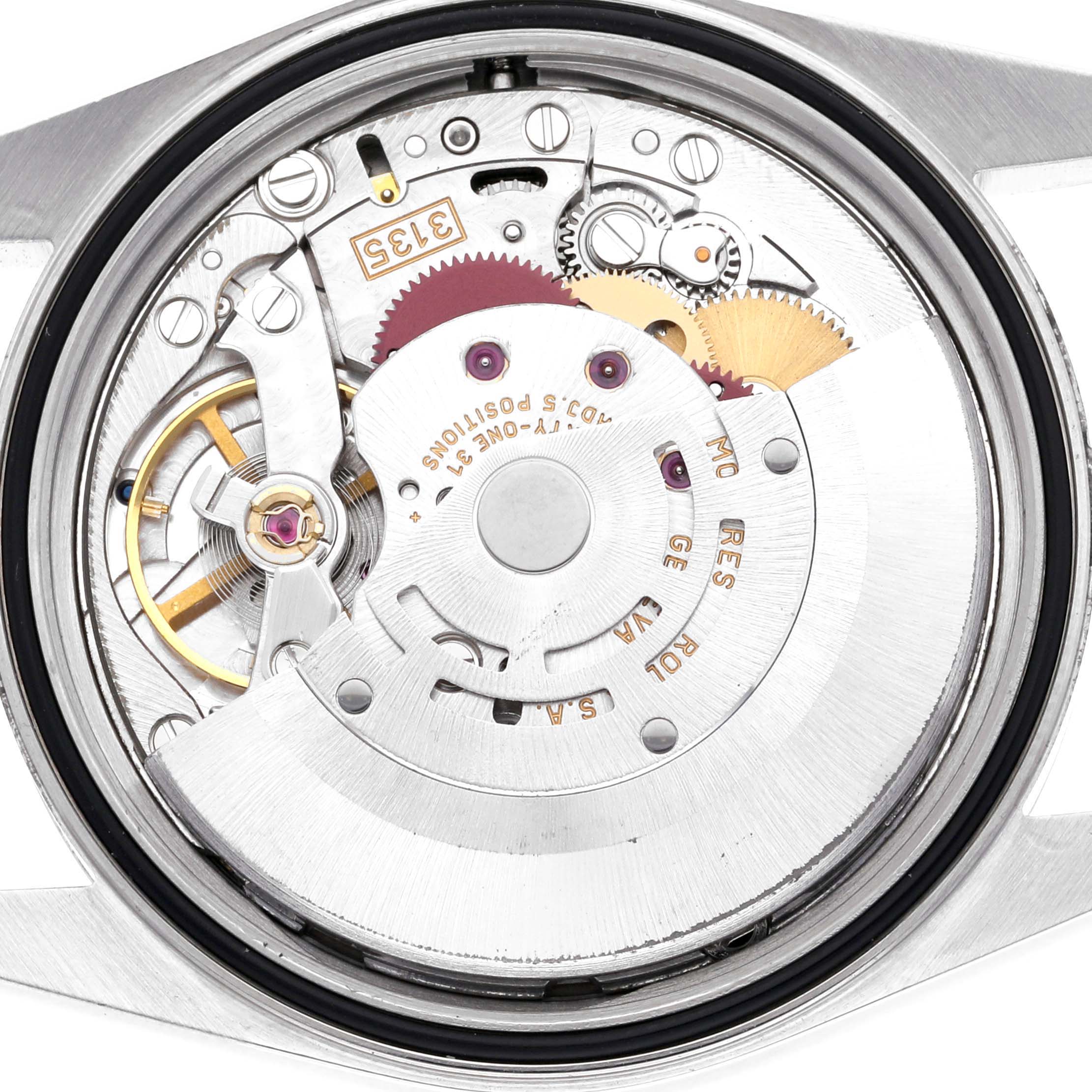 The image shows the internal movement components of a Rolex Datejust 16220 Men
s Stainless Steel White Dial 16220 Men
s Stainless Steel White Dial watch from a back angle.