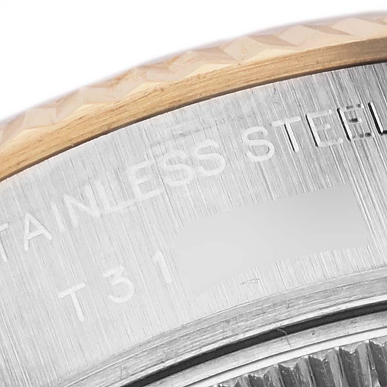 This is a close-up of a Rolex Datejust 69173 Women's Steel and Gold (two tone) White Dial 69173 Women's Steel and Gold (two tone) White Dial watch, showing the stainless steel case and part of the bezel.