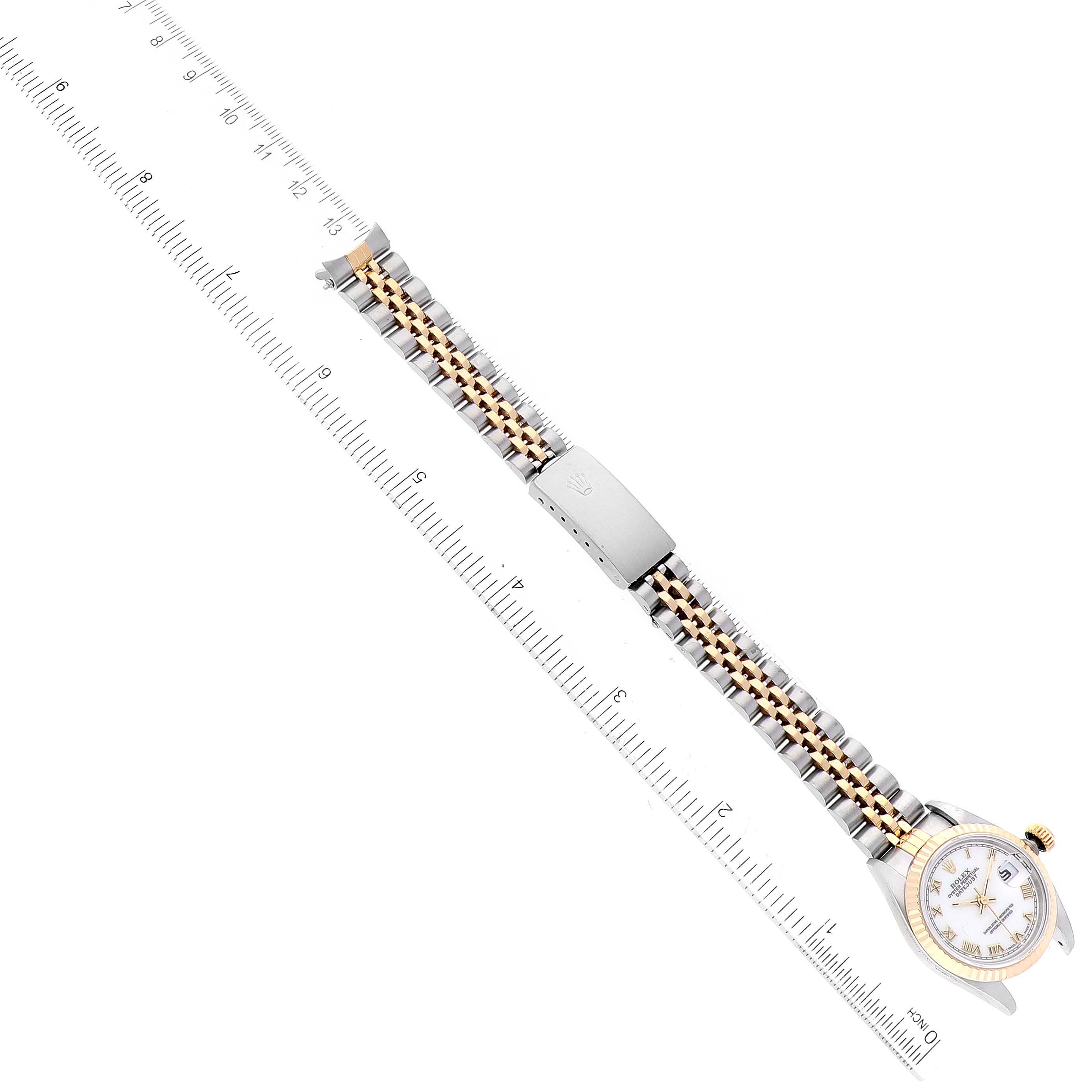 The image shows a side view of a Rolex Datejust 69173 Women's Steel and Gold (two tone) White Dial 69173 Women's Steel and Gold (two tone) White Dial watch with a ruler, displaying the watch face, case, and two-tone bracelet.