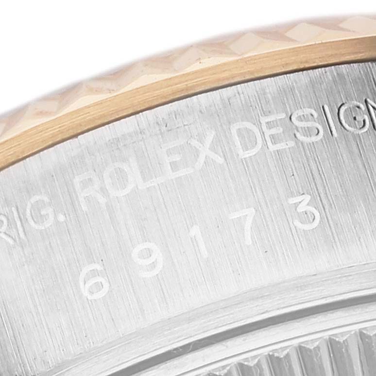 This image shows a close-up of the bezel and case side of the Rolex Datejust 69173 Women's Steel and Gold (two tone) White Dial 69173 Women's Steel and Gold (two tone) White Dial model with the engraving visible.