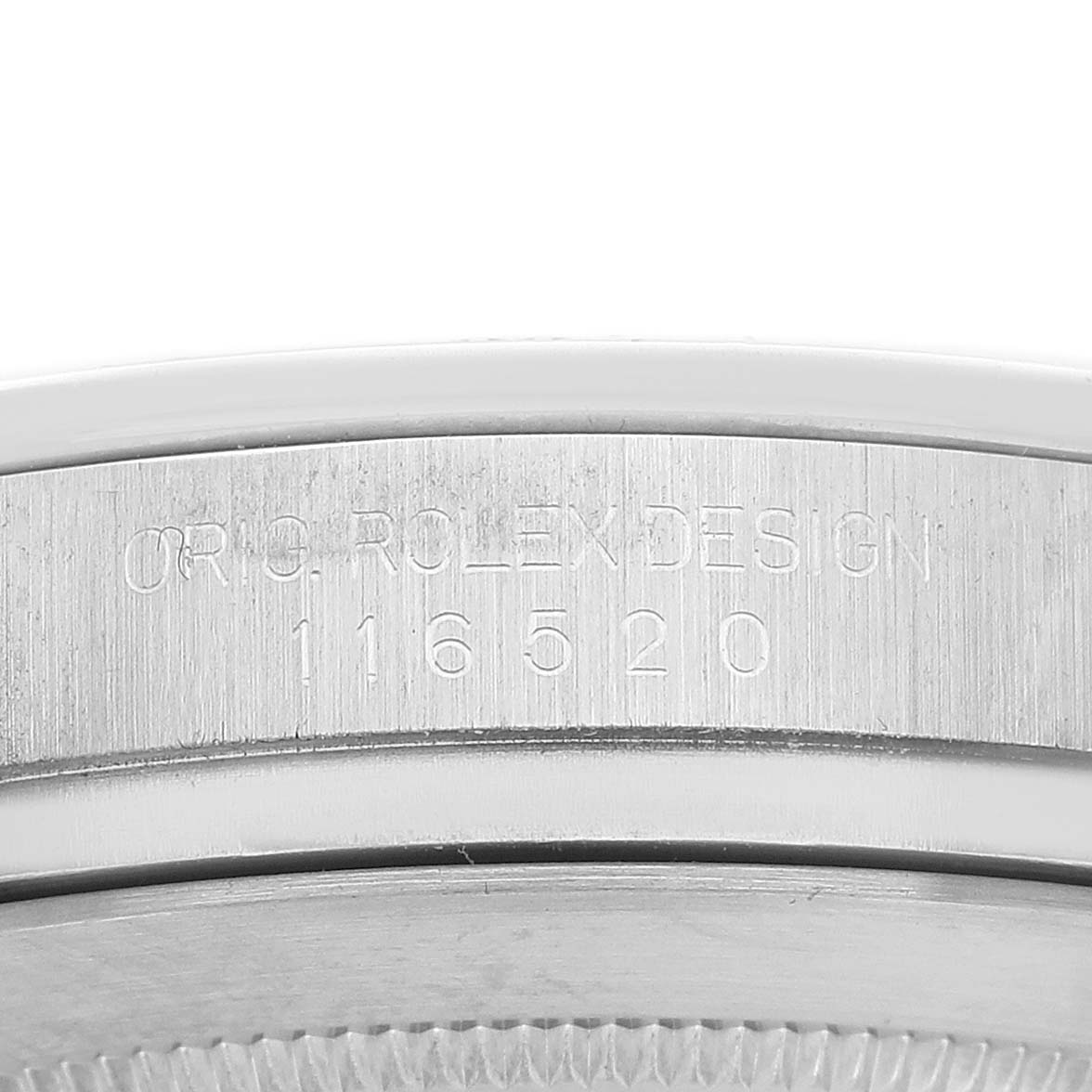The image shows the side of a Rolex Daytona 116520 Men's Stainless Steel White Dial watch case, highlighting the "ORIG ROLEX DESIGN 116520" engraving.