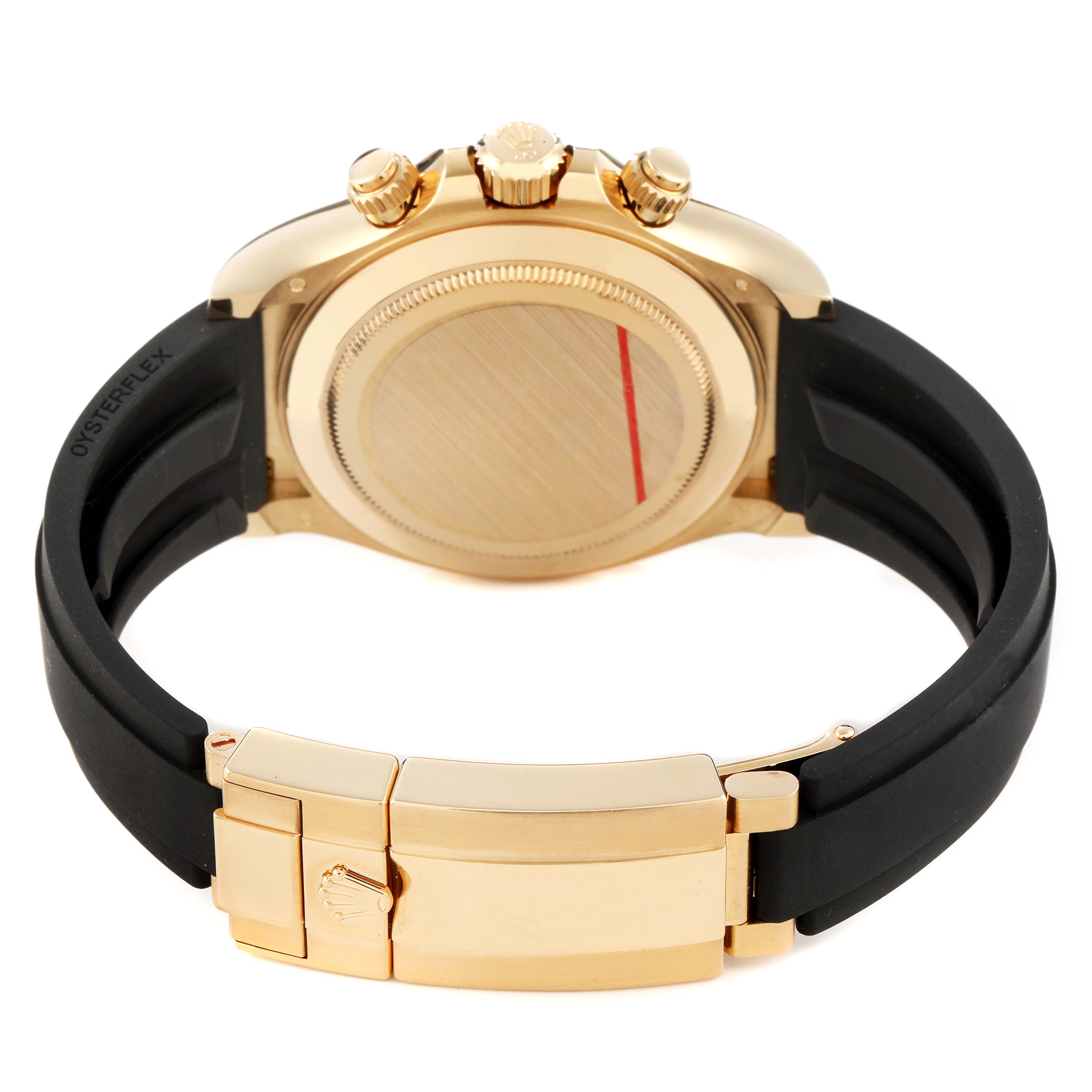 The image shows the back and clasp of a Rolex Daytona 116518 Men's Yellow Gold Black Dial, highlighting the gold case, pushers, crown, and black Oysterflex strap.