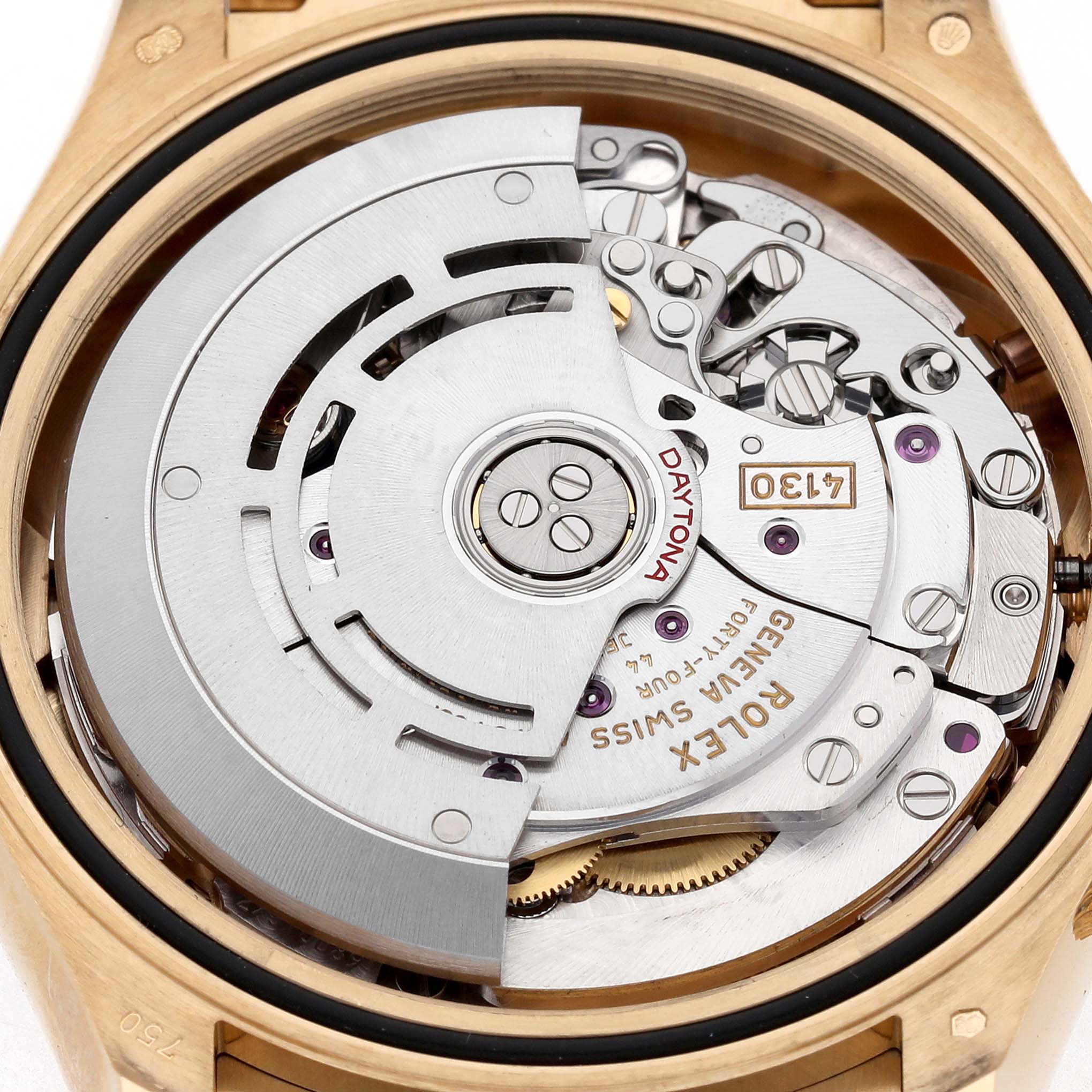 The image shows the movement of a Rolex Daytona 116518 Men's Yellow Gold Black Dial watch from the back, highlighting internal components and intricate mechanics.