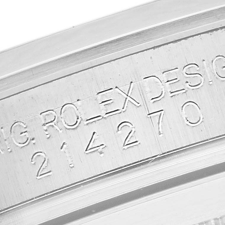 The image shows a close-up of the serial number engraving on the case side of a Rolex Explorer 214270 Men's Stainless Steel Black Dial 214270 Men's Stainless Steel Black Dial.