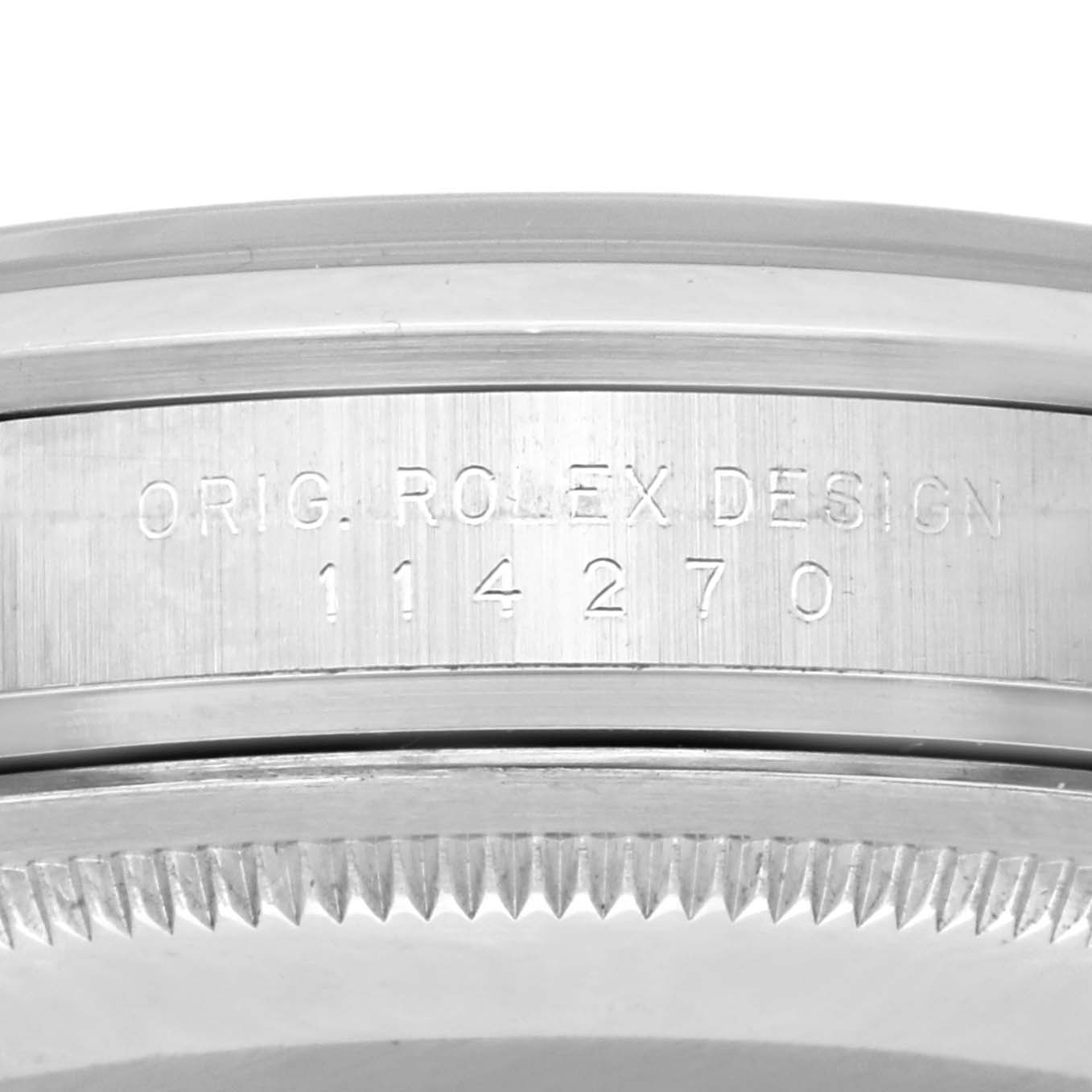 The image shows a close-up of the side engraving on the case of a Rolex Explorer 114270 Men's Stainless Steel Black Dial 114270 Men's Stainless Steel Black Dial watch, displaying the model number.