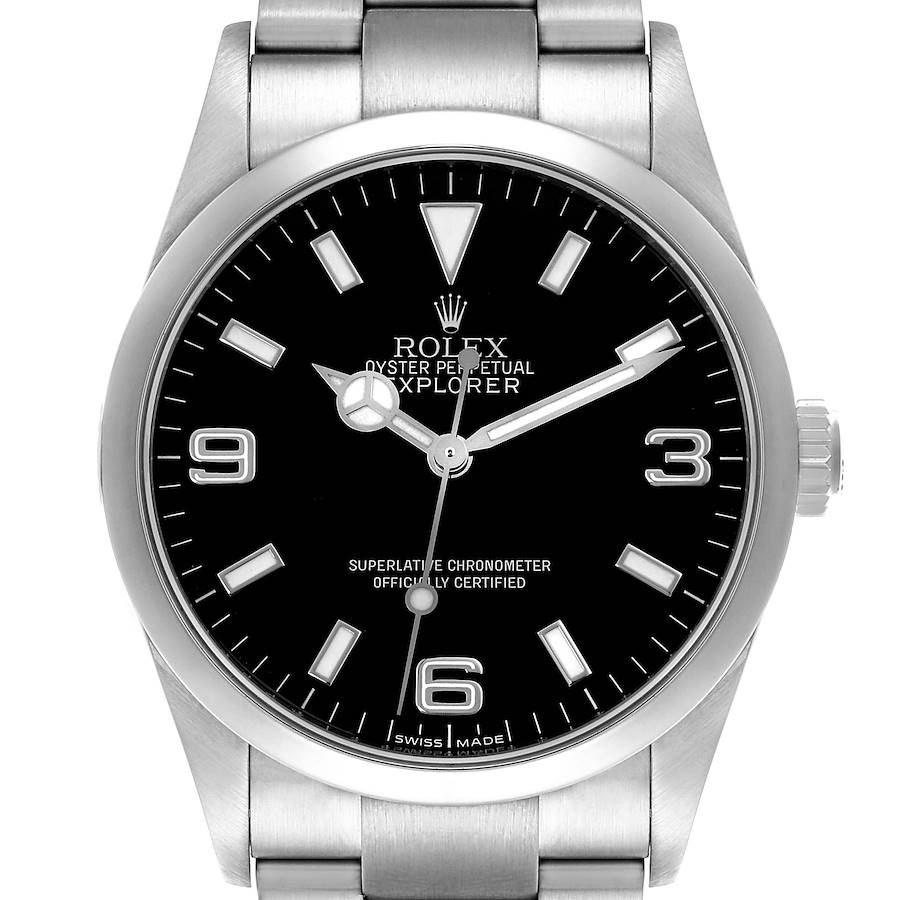 The Rolex Explorer watch is shown from a front angle, displaying the face, bezel, crown, and part of the bracelet.