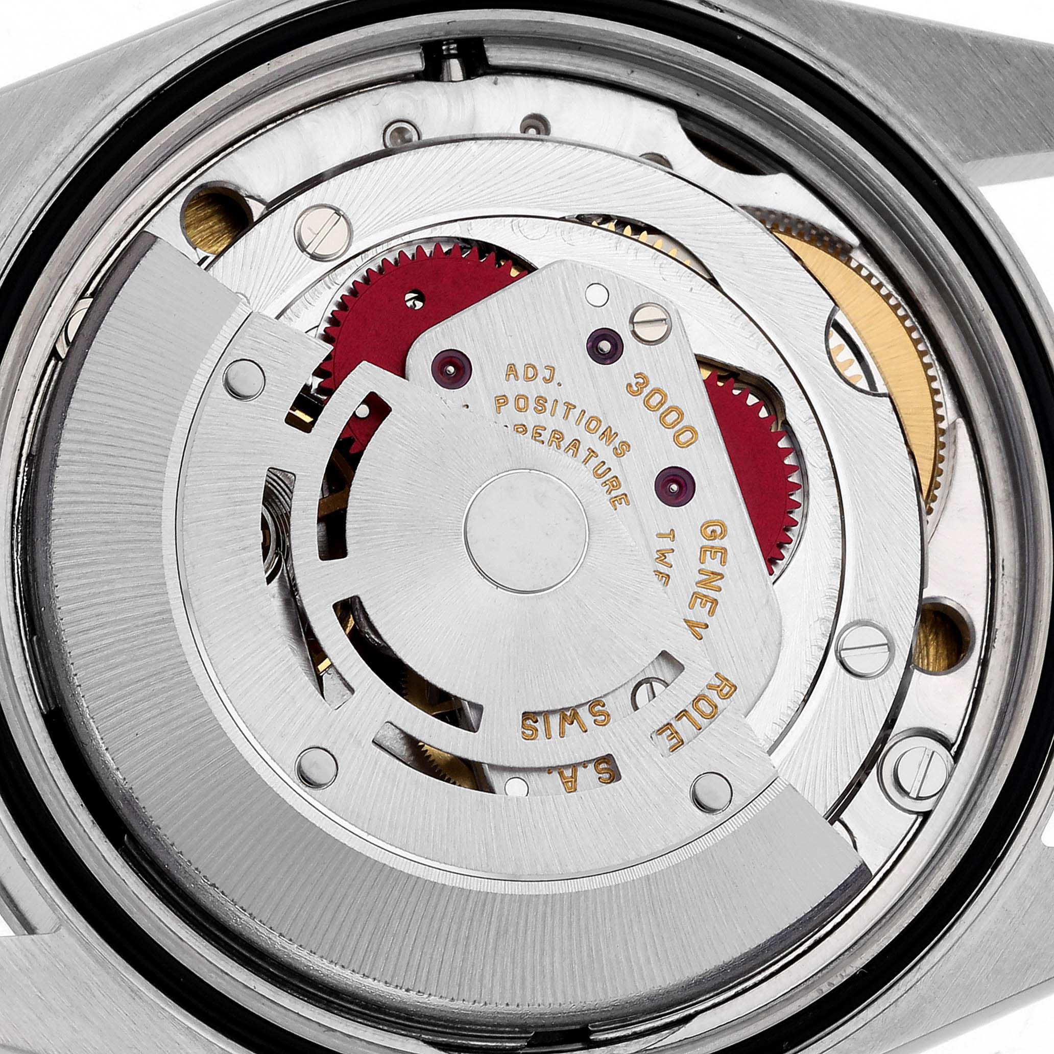 The image shows the movement of a Rolex Explorer 14270 Men's Stainless Steel Black Dial 14270 Men's Stainless Steel Black Dial watch from the back, revealing gears and intricate mechanical components.