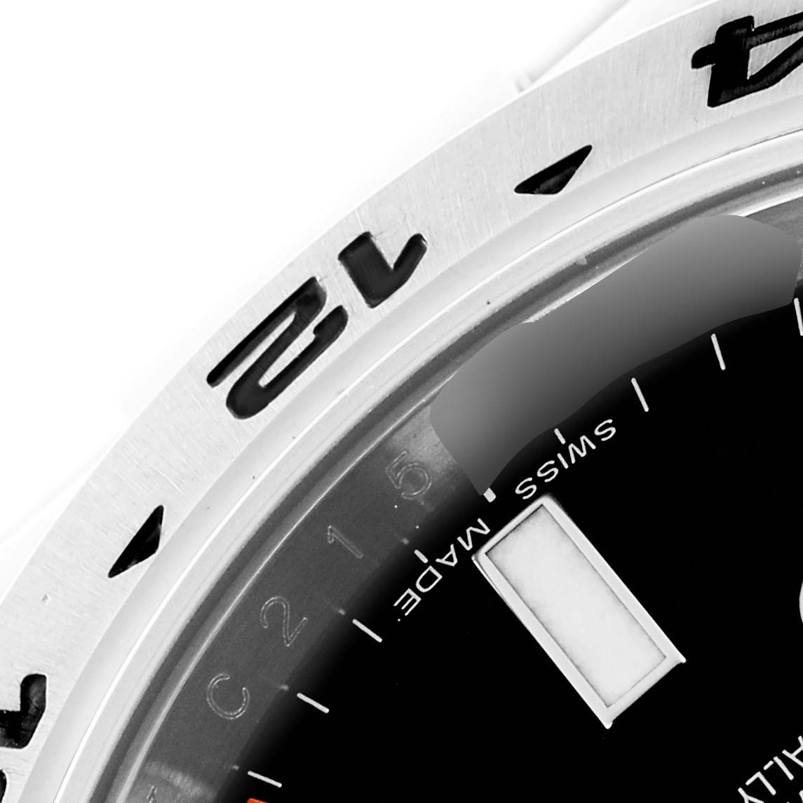 The image shows a close-up of the bezel and part of the dial of a Rolex Explorer 216570 Men's Stainless Steel Black Dial 216570 Men's Stainless Steel Black Dial watch.