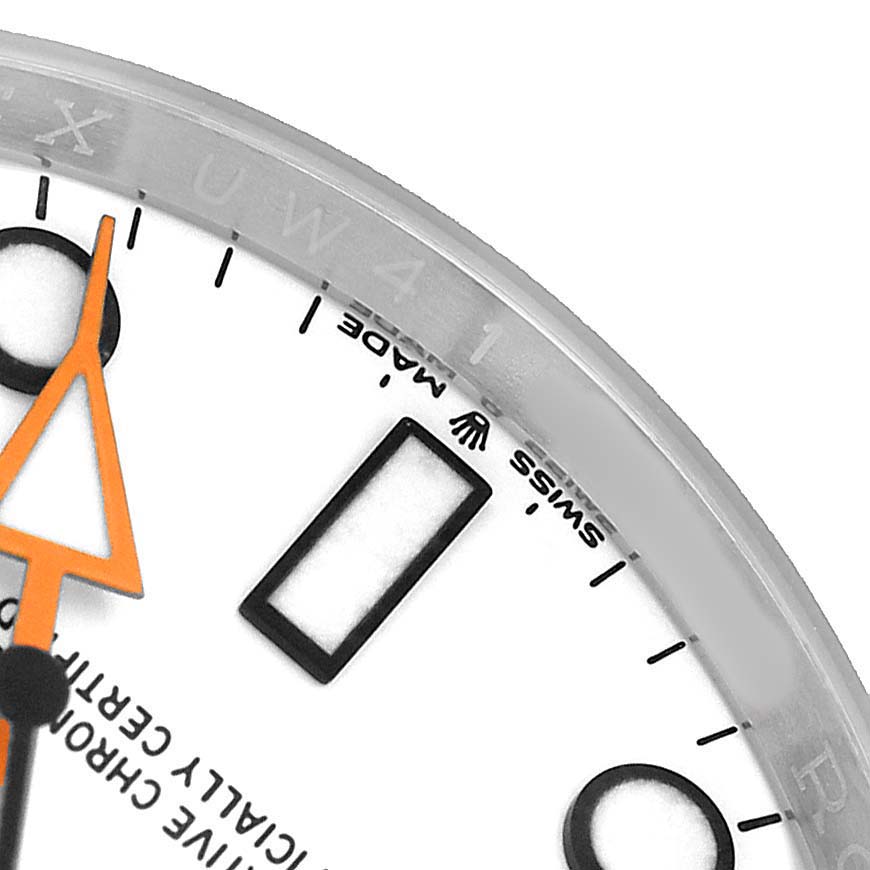 The image shows a close-up of the dial and hands of a Rolex Explorer 226570 Men's Stainless Steel White Dial watch at an angle, highlighting the bezel and indices.