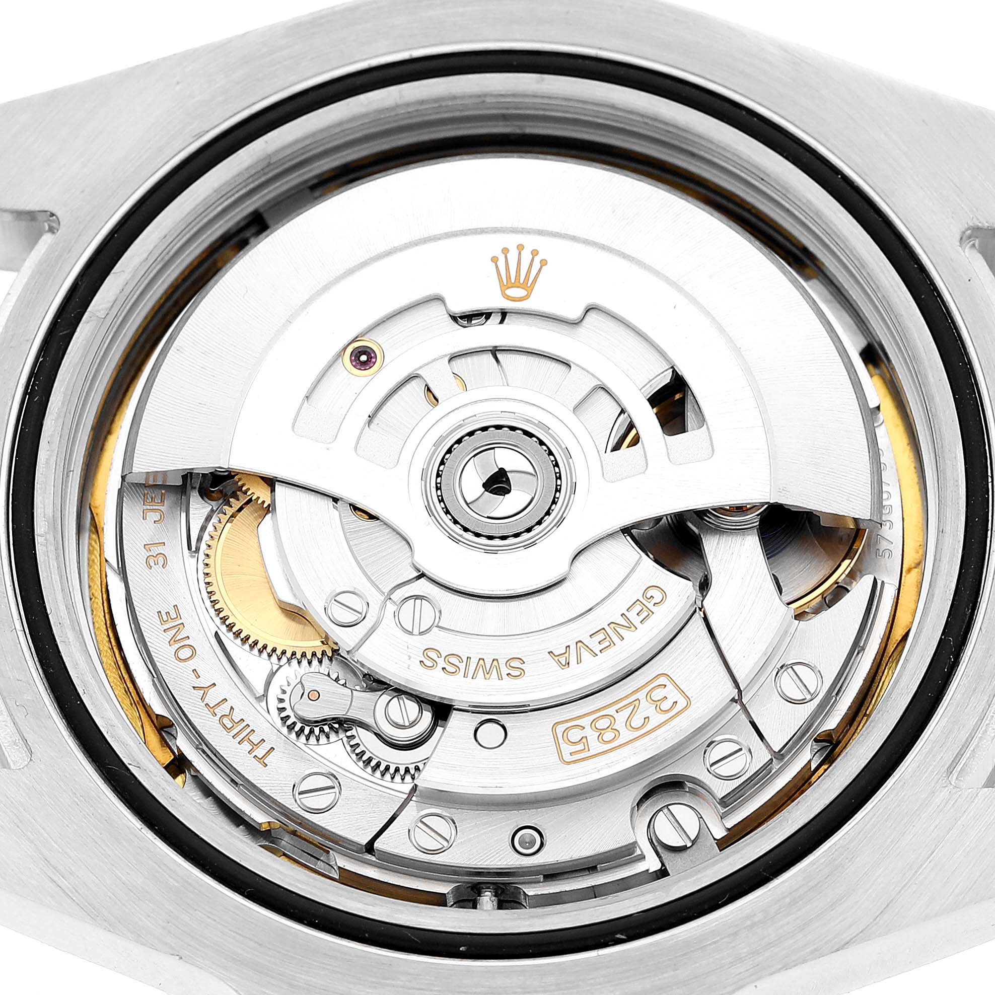 The image shows the movement of a Rolex Explorer 226570 Men's Stainless Steel White Dial watch viewed from the back, highlighting the rotor and mechanical components.