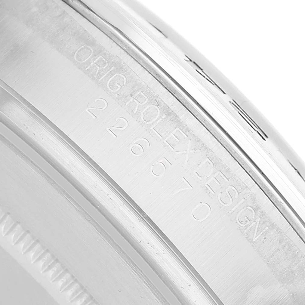 The image shows an angled close-up of the Rolex Explorer 226570 Men's Stainless Steel White Dial's case edge with model engraving.