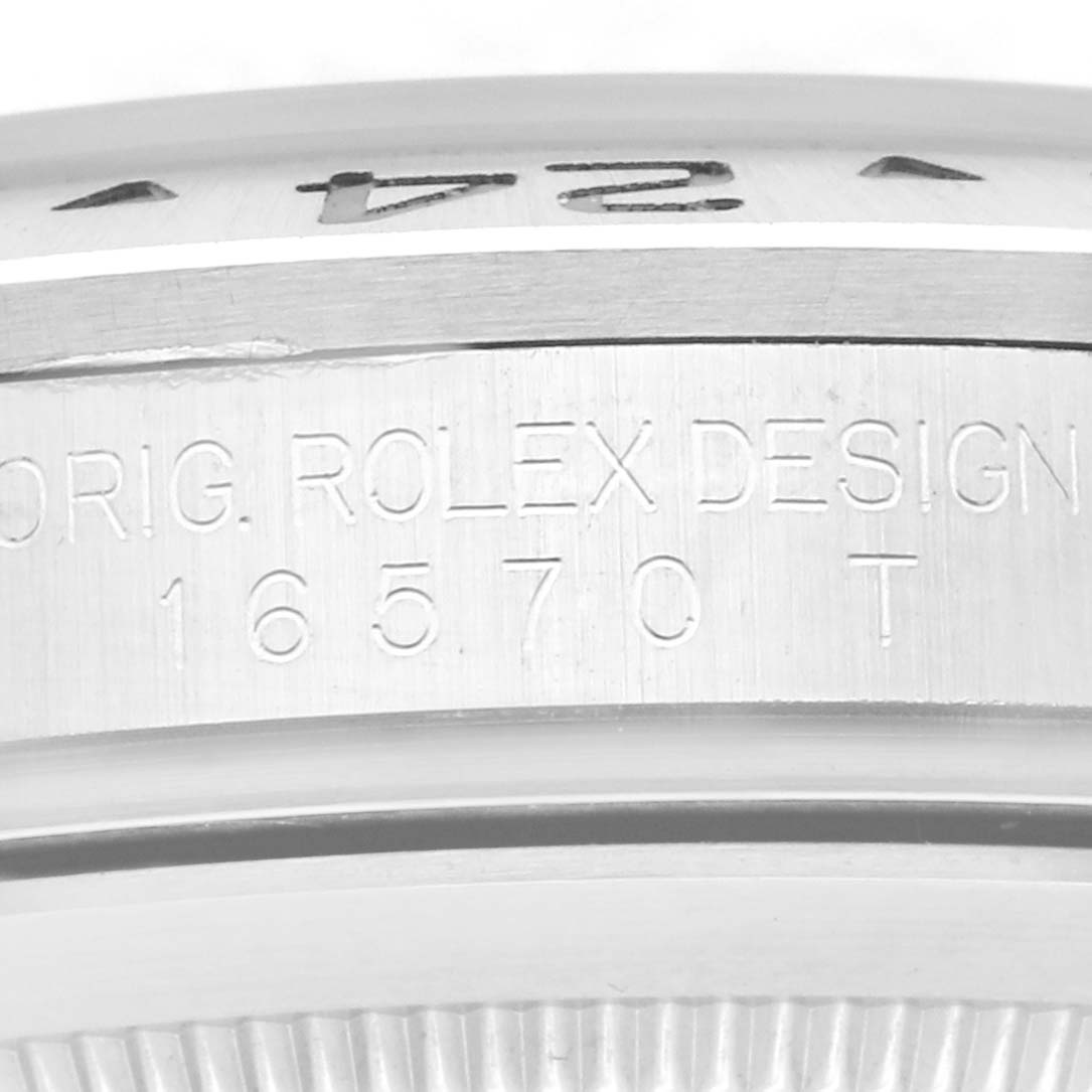 The image shows a close-up of the casing side with engraved text on the Rolex Explorer 16570T Men's Stainless Steel Black Dial 16570T Men's Stainless Steel Black Dial model.