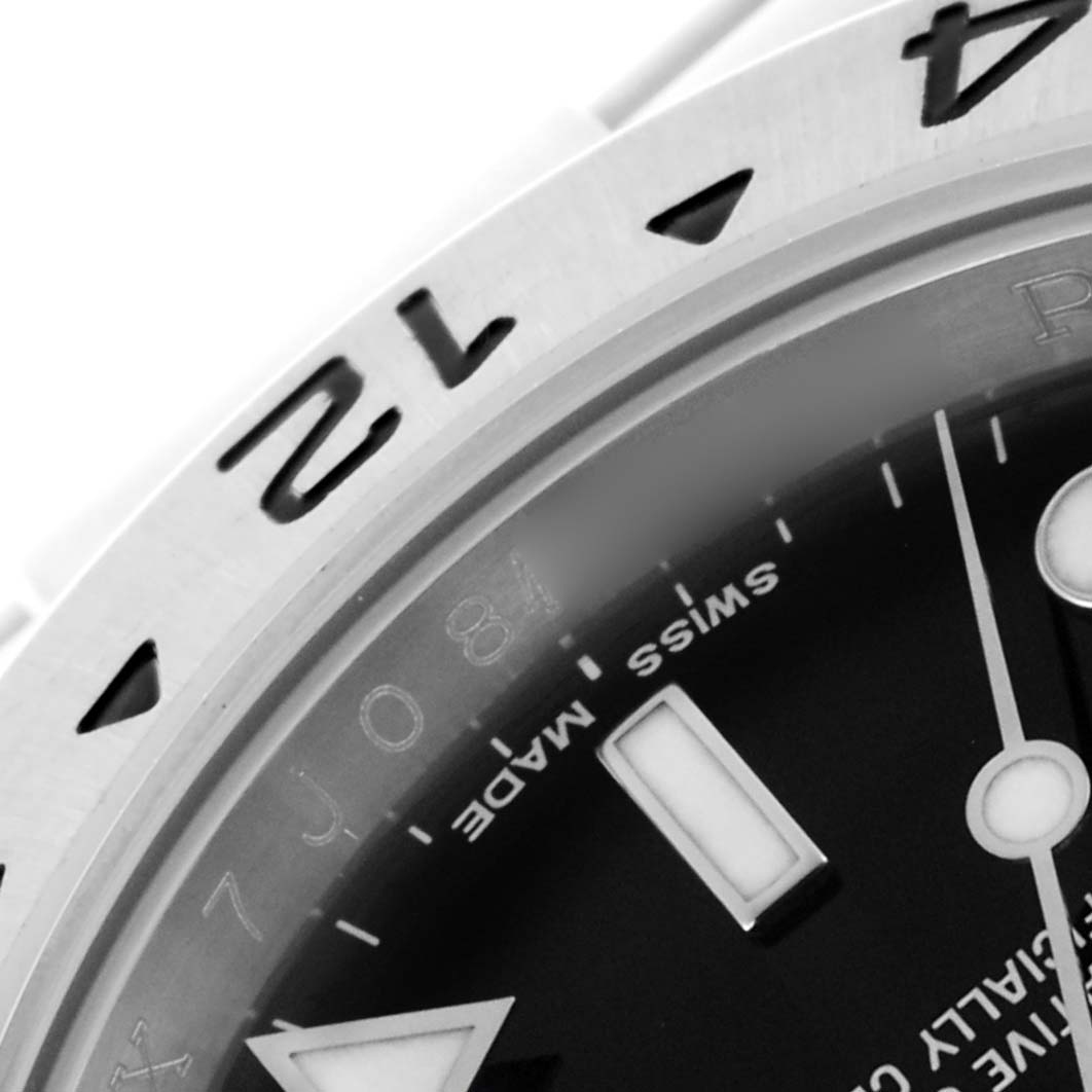 The image shows a close-up angle of the Rolex Explorer 16570T Men's Stainless Steel Black Dial 16570T Men's Stainless Steel Black Dial, highlighting the bezel, part of the dial, and hour markers.