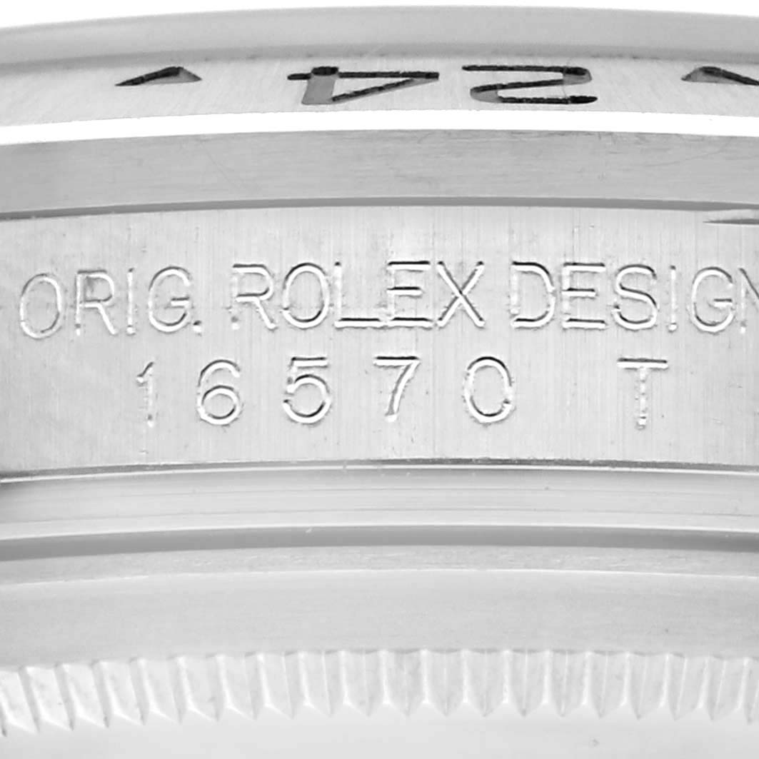 The image shows a close-up of the case engraving on a Rolex Explorer 16570 Men's Stainless Steel White Dial 16570 Men's Stainless Steel White Dial, highlighting "ORIG. ROLEX DESIGN" and model number 16570.