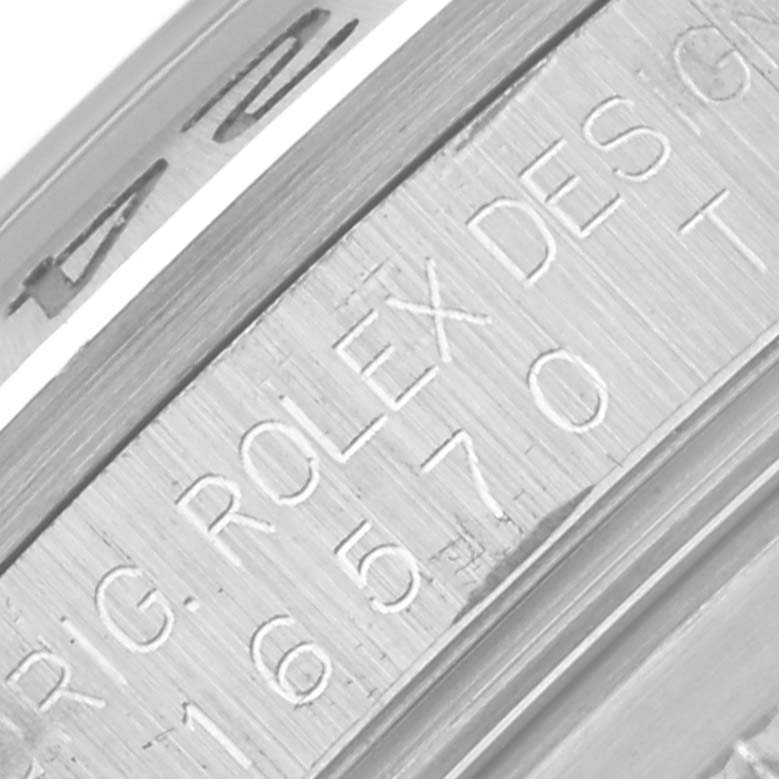 The image shows a close-up of the engraved inner bezel of a Rolex Explorer 16570 Men's Stainless Steel White Dial 16570 Men's Stainless Steel White Dial watch.