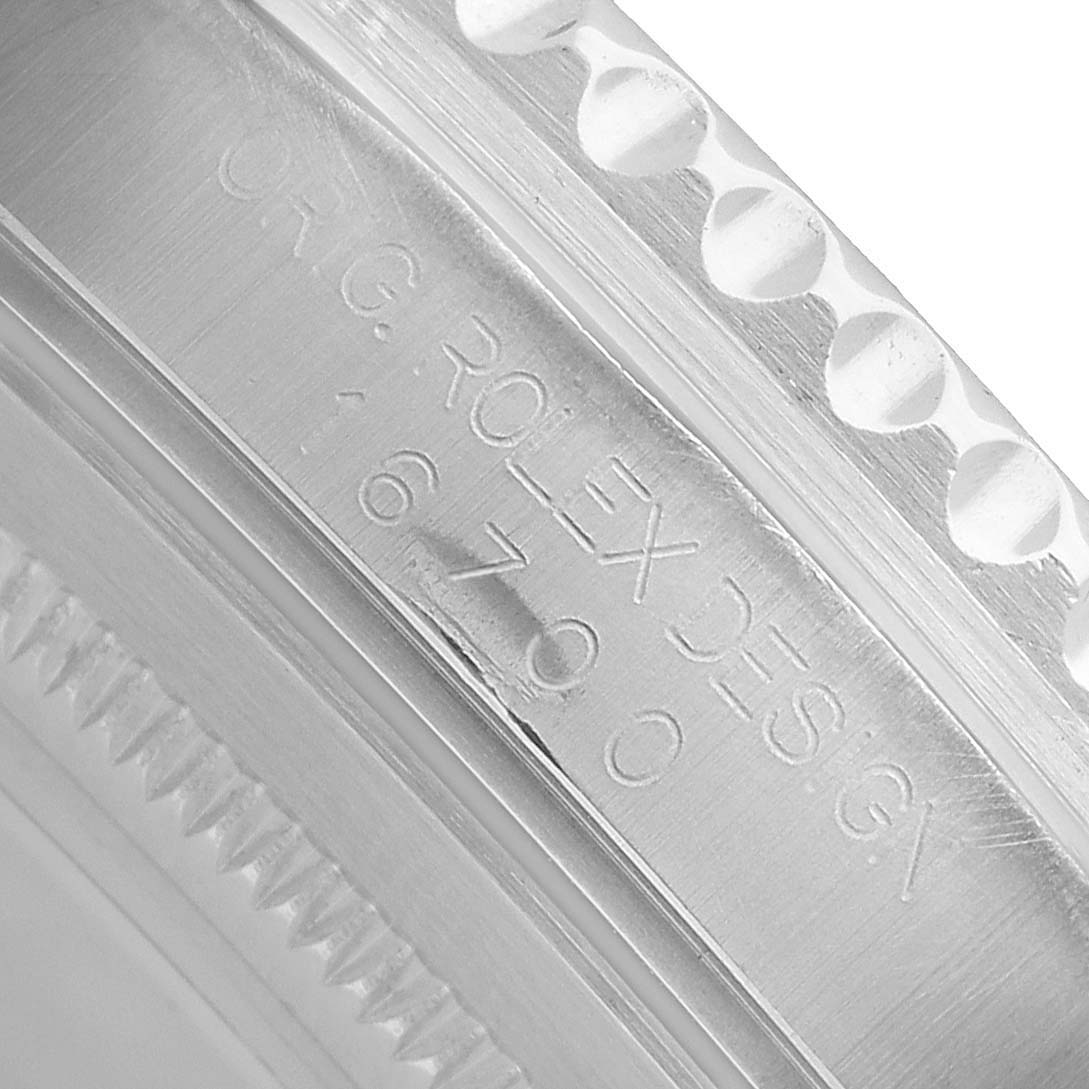 The image shows a close-up of the case edge of a Rolex GMT-Master 16700 Men's Stainless Steel Black Dial, highlighting the model number engraving.