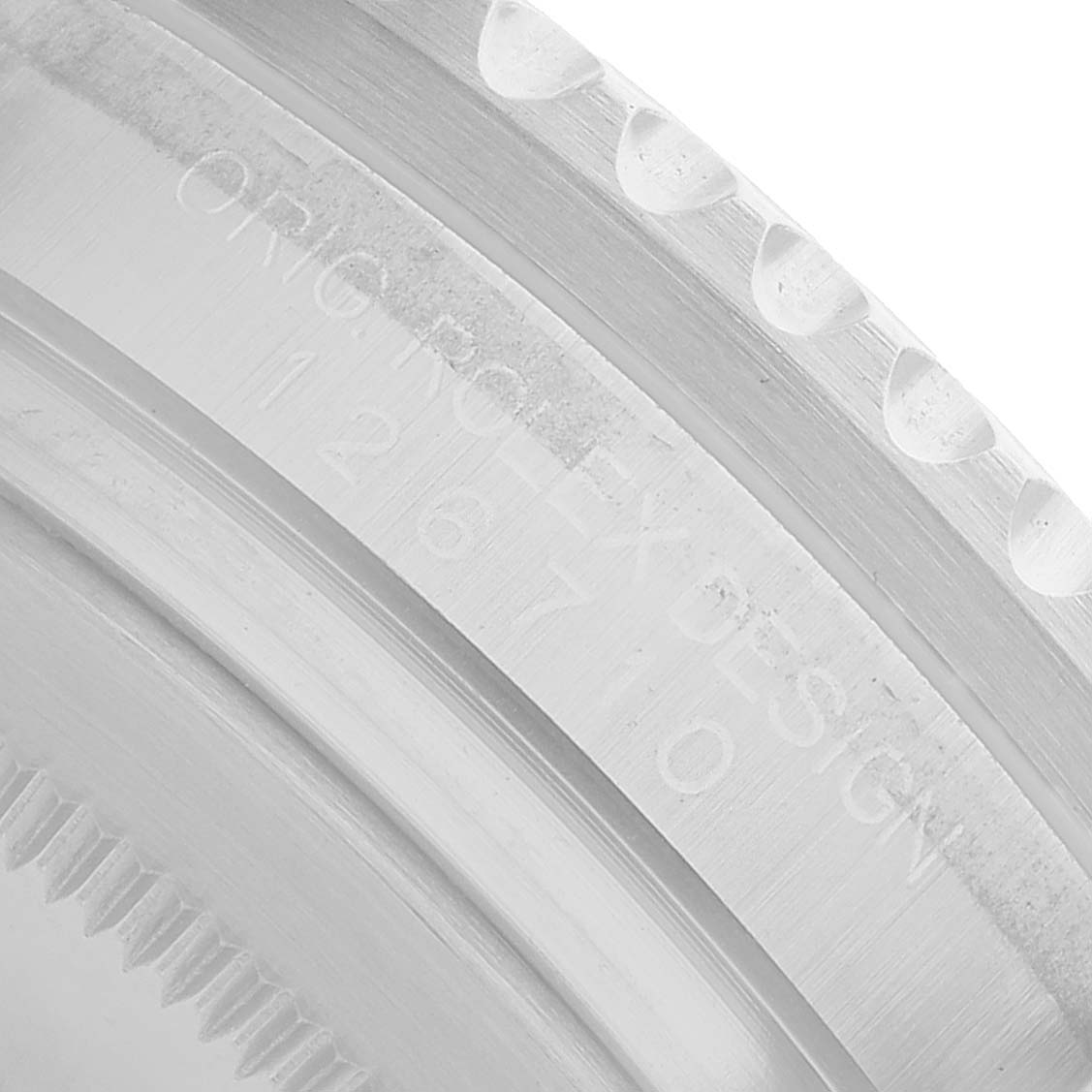 The image shows a close-up of the side edge and engravings on the bezel of a Rolex GMT-Master 126710 Men's Stainless Steel Black Dial watch.