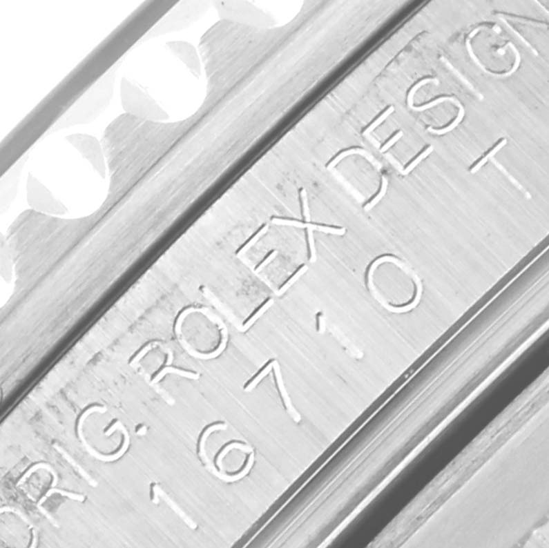 The image shows a close-up of the side engraving on a Rolex GMT-Master 16710 Men's Stainless Steel Black Dial 16710 Men's Stainless Steel Black Dial, highlighting the model number and logo.