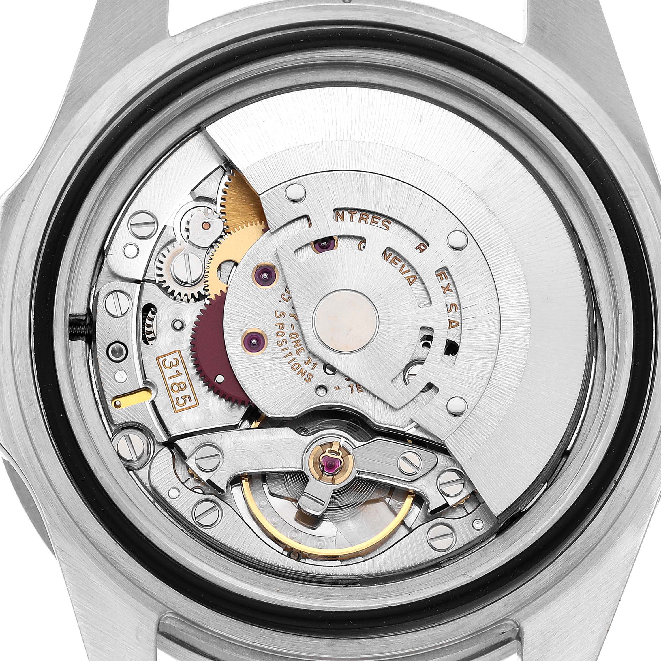 The image shows the movement mechanism of a Rolex GMT-Master 16710 Men's Stainless Steel Black Dial, viewed from the back with visible gears and components.