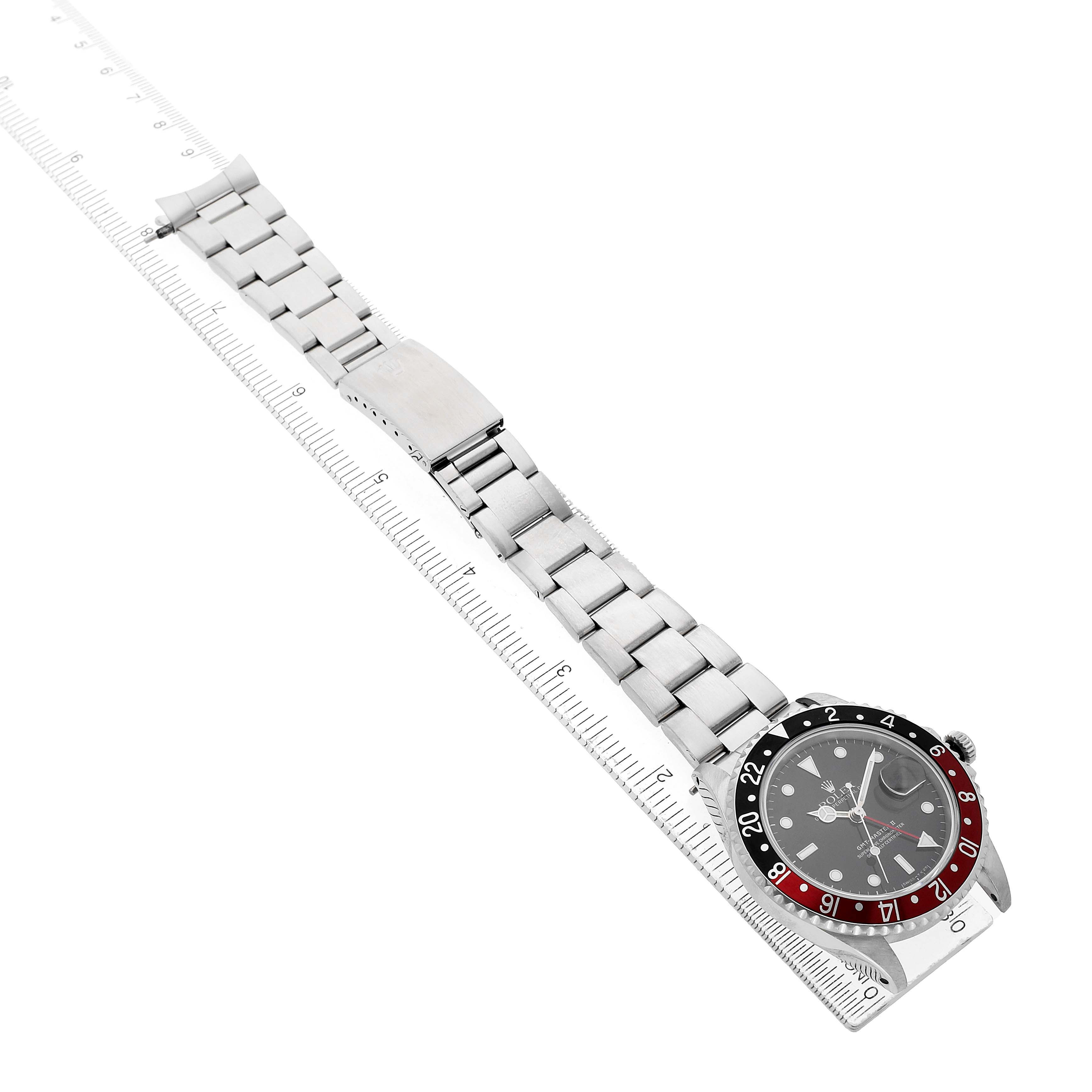 The Rolex GMT-Master 16710 Men's Stainless Steel Black Dial watch is shown at an angled top-down view, displaying the full bracelet and bezel.