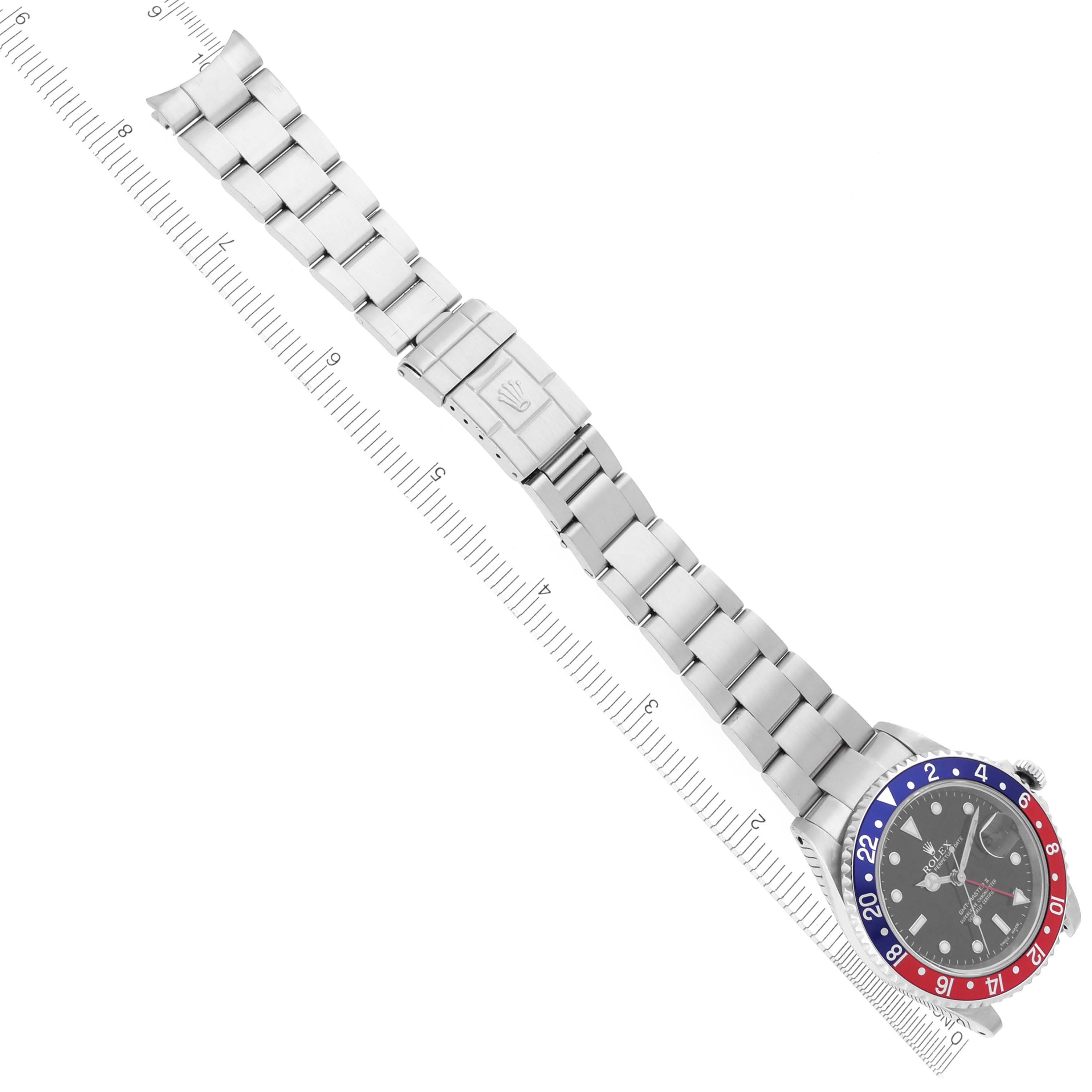 The Rolex GMT-Master 16710 Men
s Stainless Steel Black Dial 16710 Men
s Stainless Steel Black Dial watch is shown from a top-down angle, displaying its full bracelet and bi-color bezel.