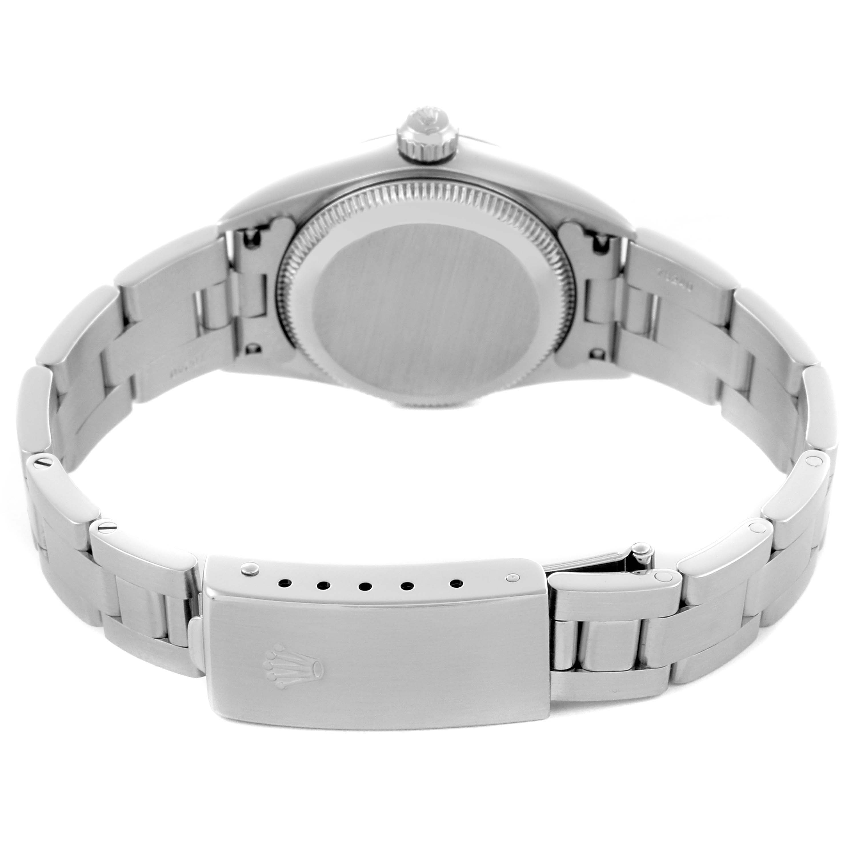 The Rolex Oyster Perpetual 76094 Women's Stainless Steel Black Dial 76094 Women's Stainless Steel Black Dial watch is shown from the back, highlighting the case back, crown, and bracelet clasp.