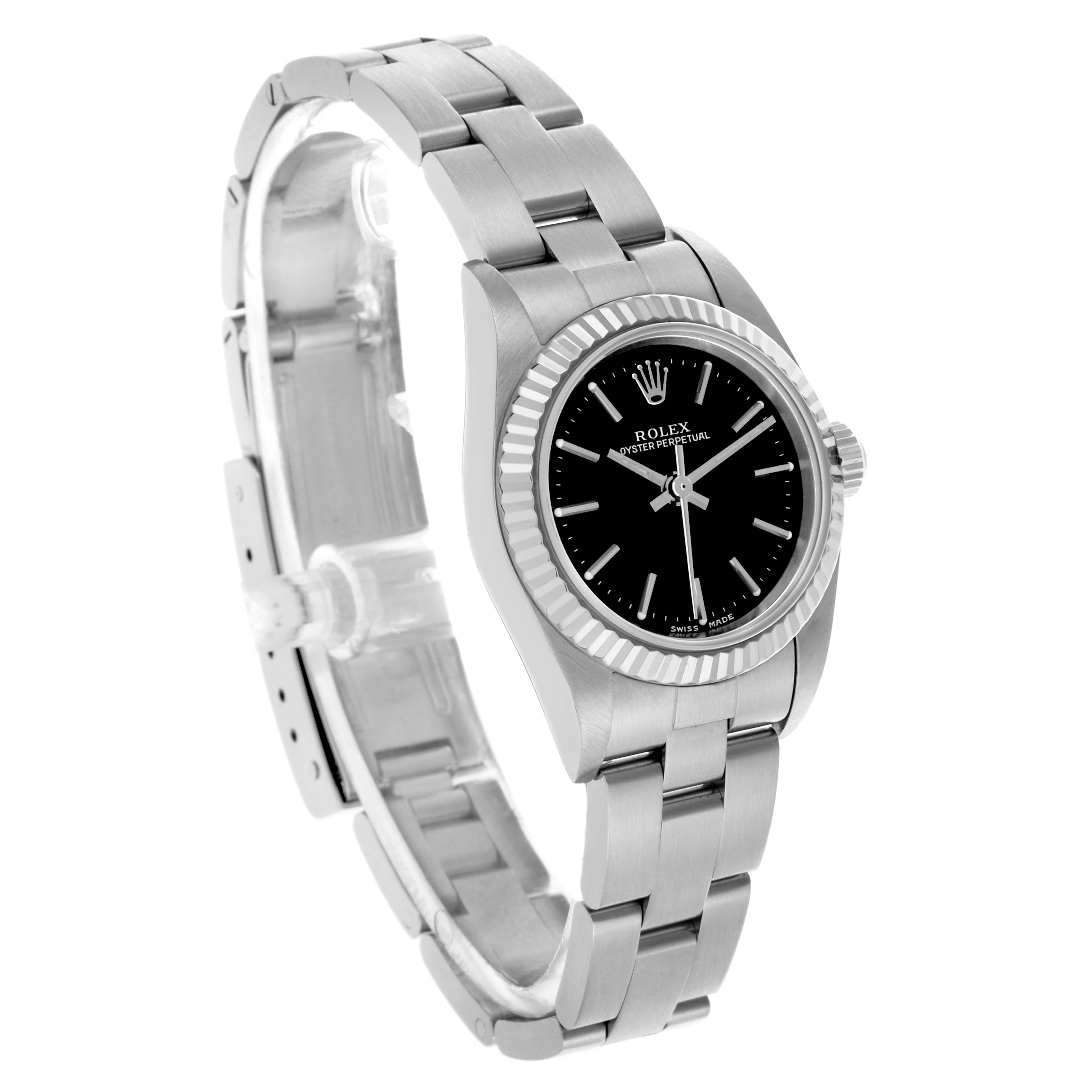 The Rolex Oyster Perpetual 76094 Women's Stainless Steel Black Dial 76094 Women's Stainless Steel Black Dial watch is shown at a three-quarter angle, highlighting the black dial, fluted bezel, and stainless steel bracelet.