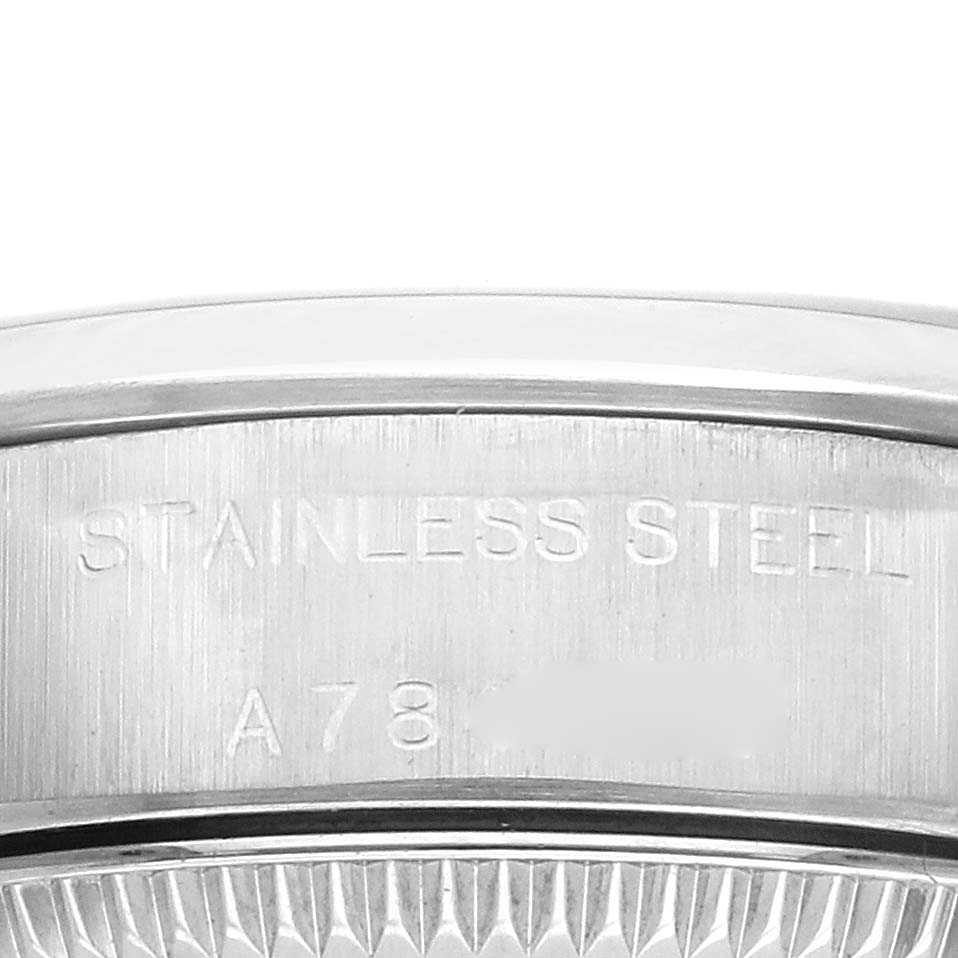 The image shows the side view of the case back engraving on a Rolex Oyster Perpetual 76080 Women's Stainless Steel Pink Dial 76080 Women's Stainless Steel Pink Dial watch, highlighting "Stainless Steel."